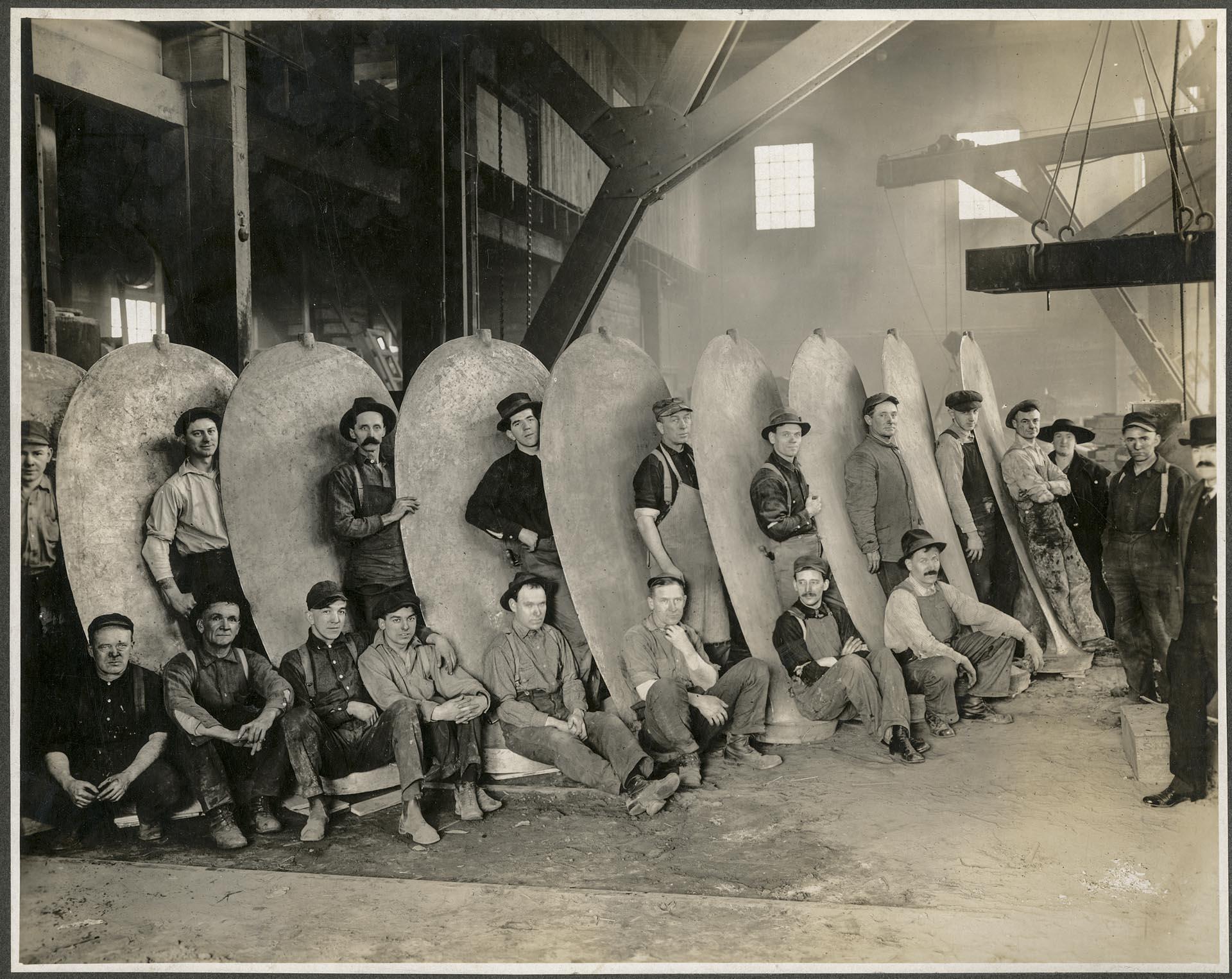 Image of Coolidge Propeller Co. employees posing with large propeller, Seattle, 1911