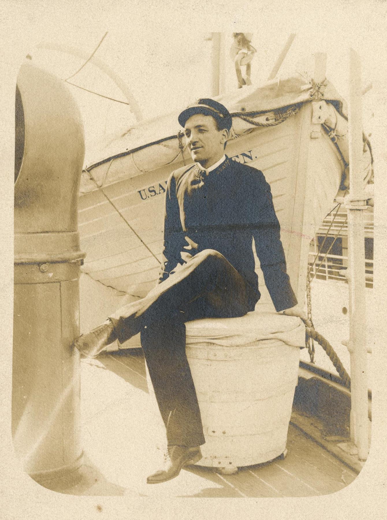 Image of Frank James sitting on ship deck, circa 1895