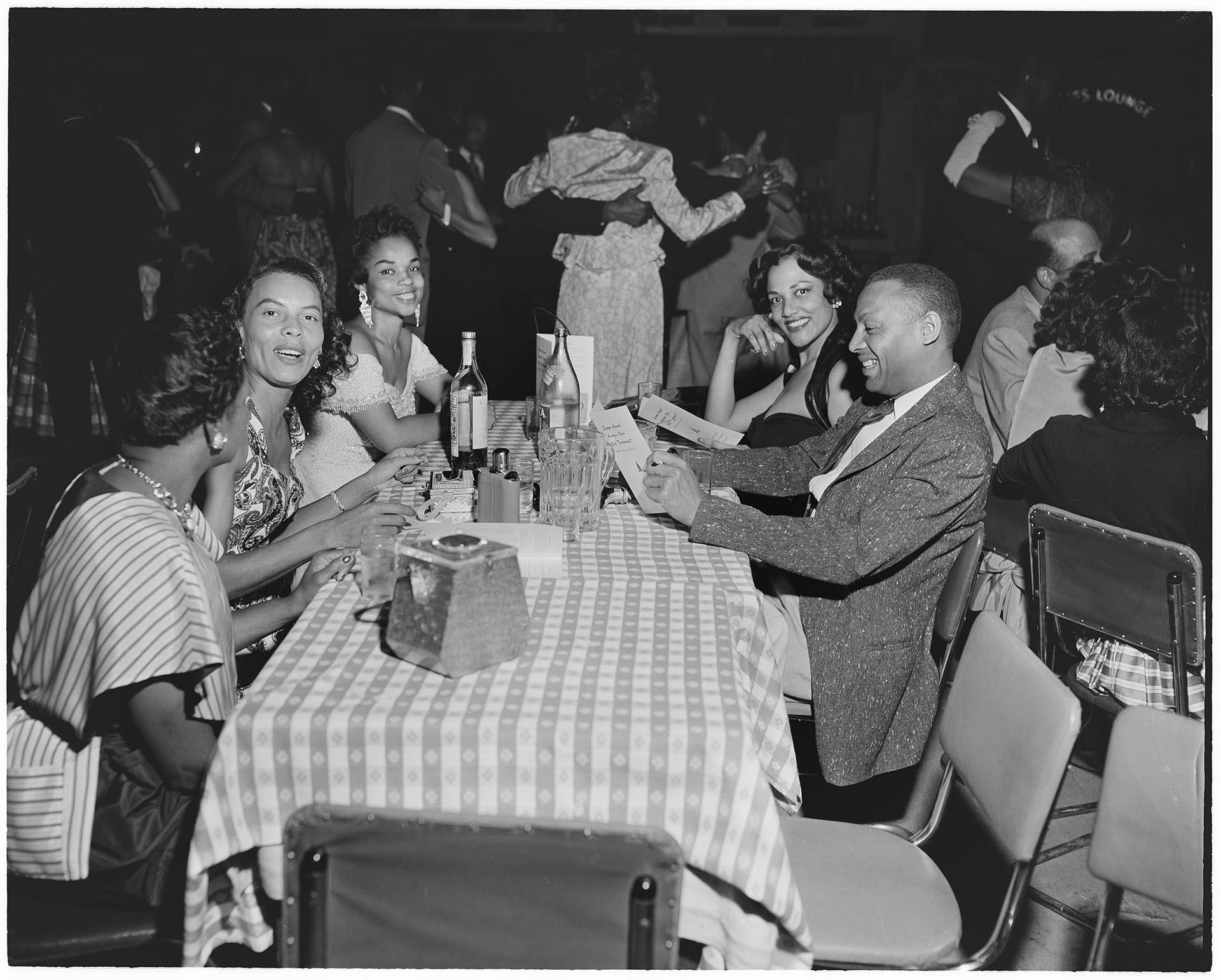 Image of Group of friends around table at a nightclub, Seattle, 1947