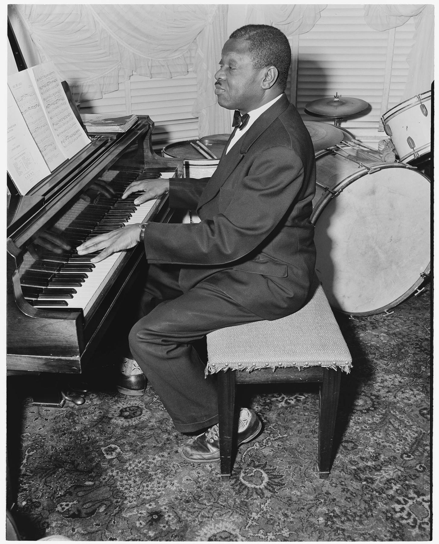 Image of Oscar Holden Sr. at the piano, Seattle, June 9, 1952