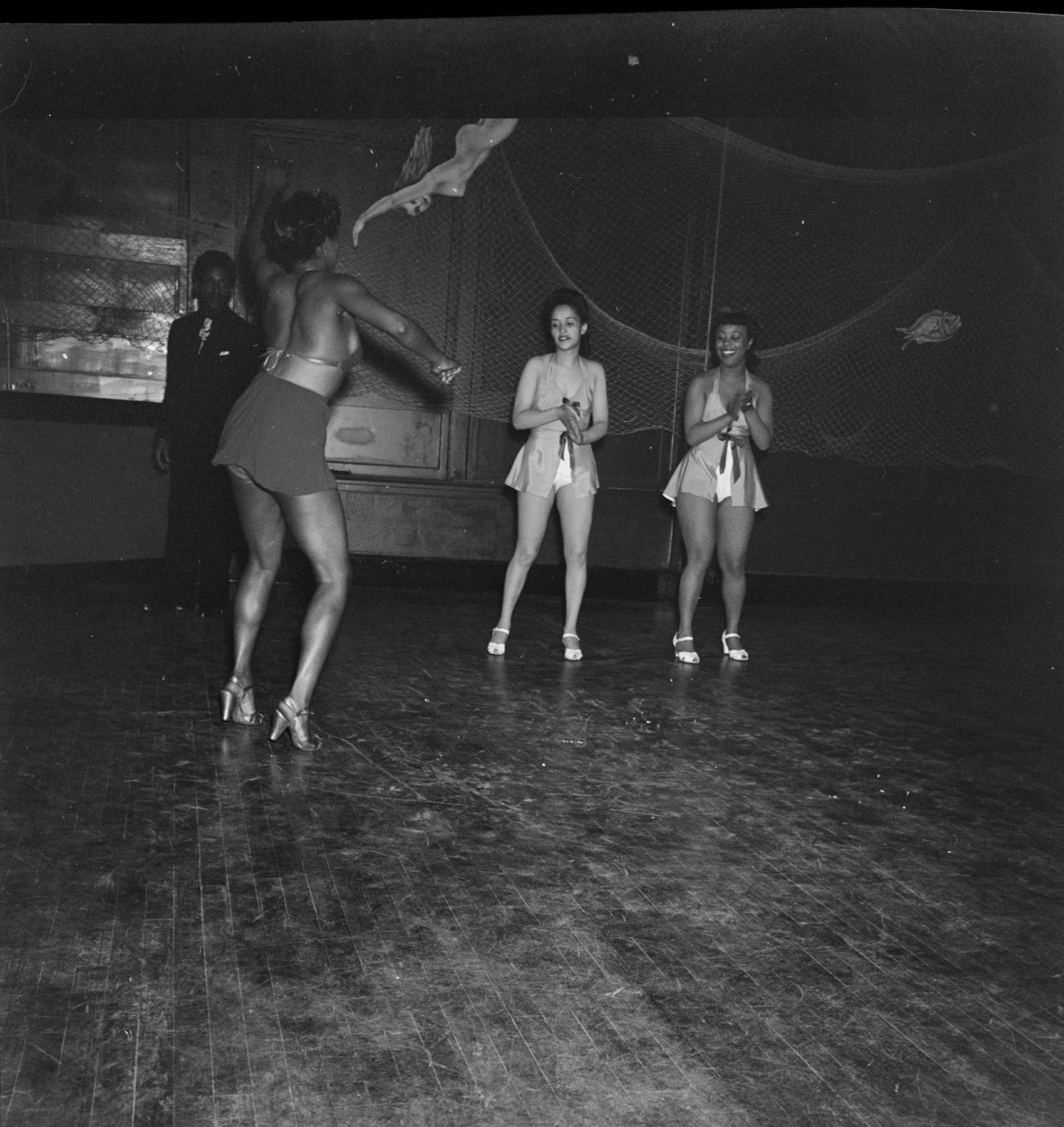 Image of Costumed women dancing, June 22, 1944