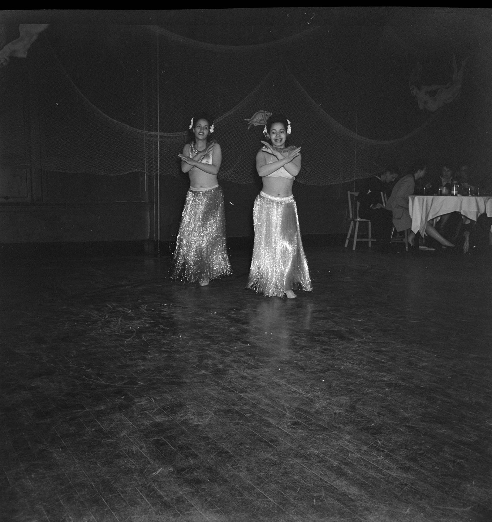 Image of Dancing women in grass skirt costumes, Seattle, June 22, 1944