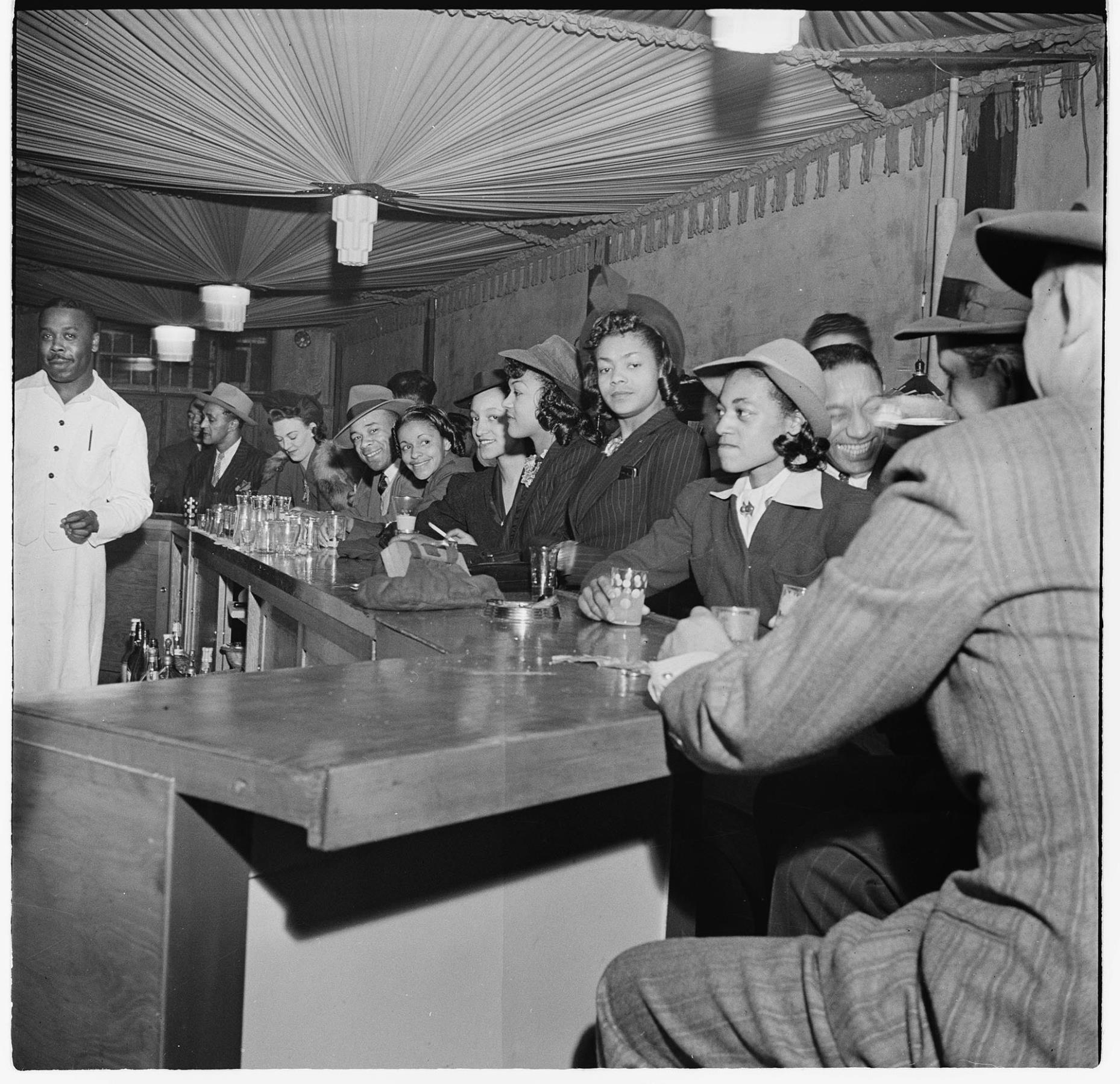 Image of Large group seated at a bar, circa 1947