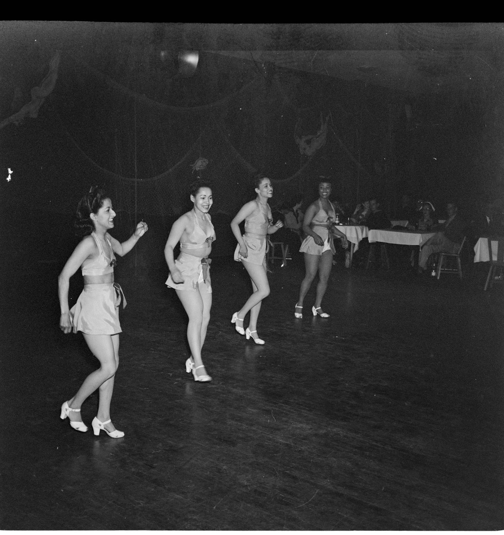 Image of Costumed women dancing, June 22, 1944