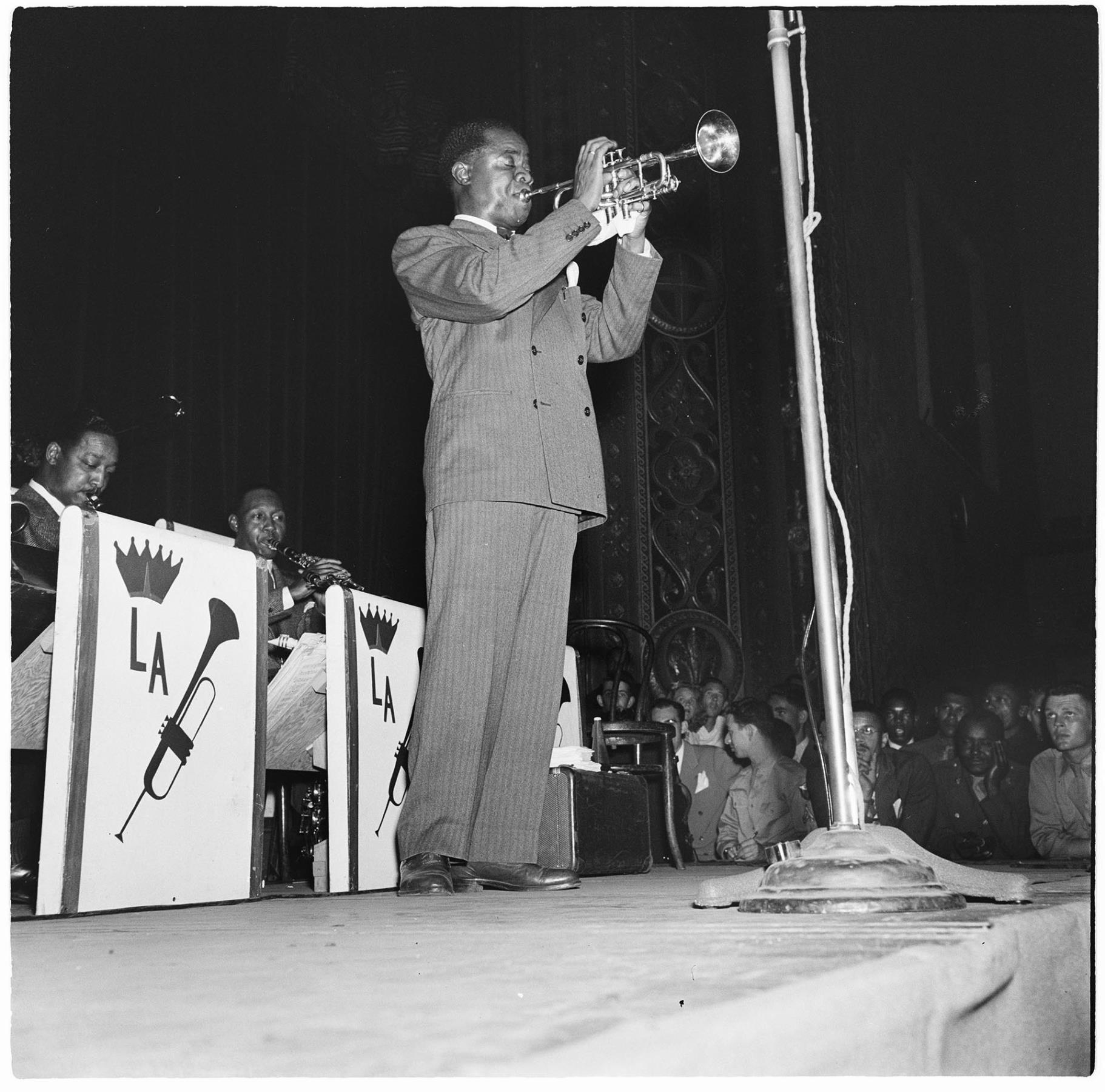 Image of Louis Armstrong playing the trumpet with his band, Seattle, July 17, 1944