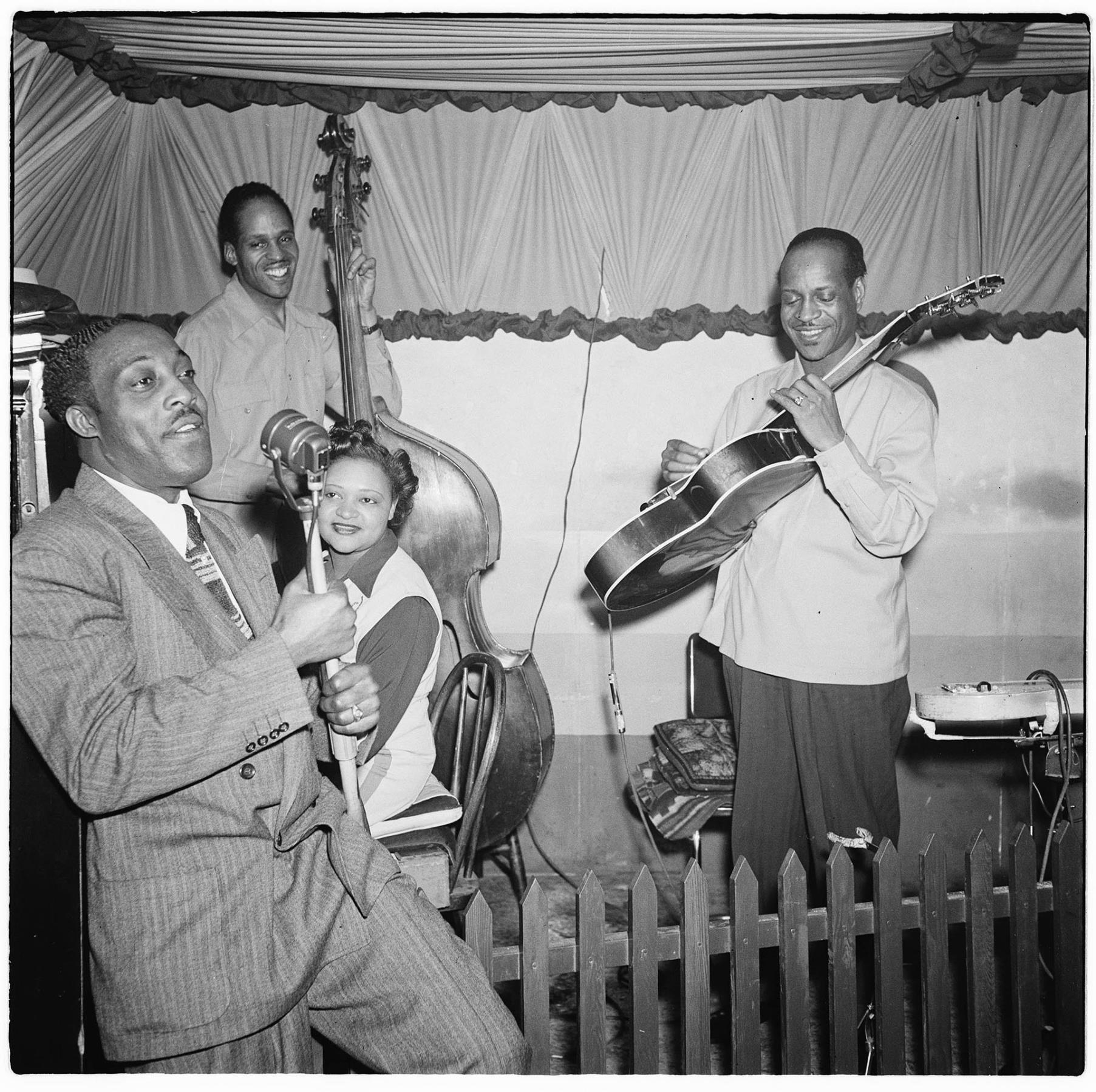 Image of Jazz trio with vocalist on stage at the Basin Street club, Seattle, March 24, 1945
