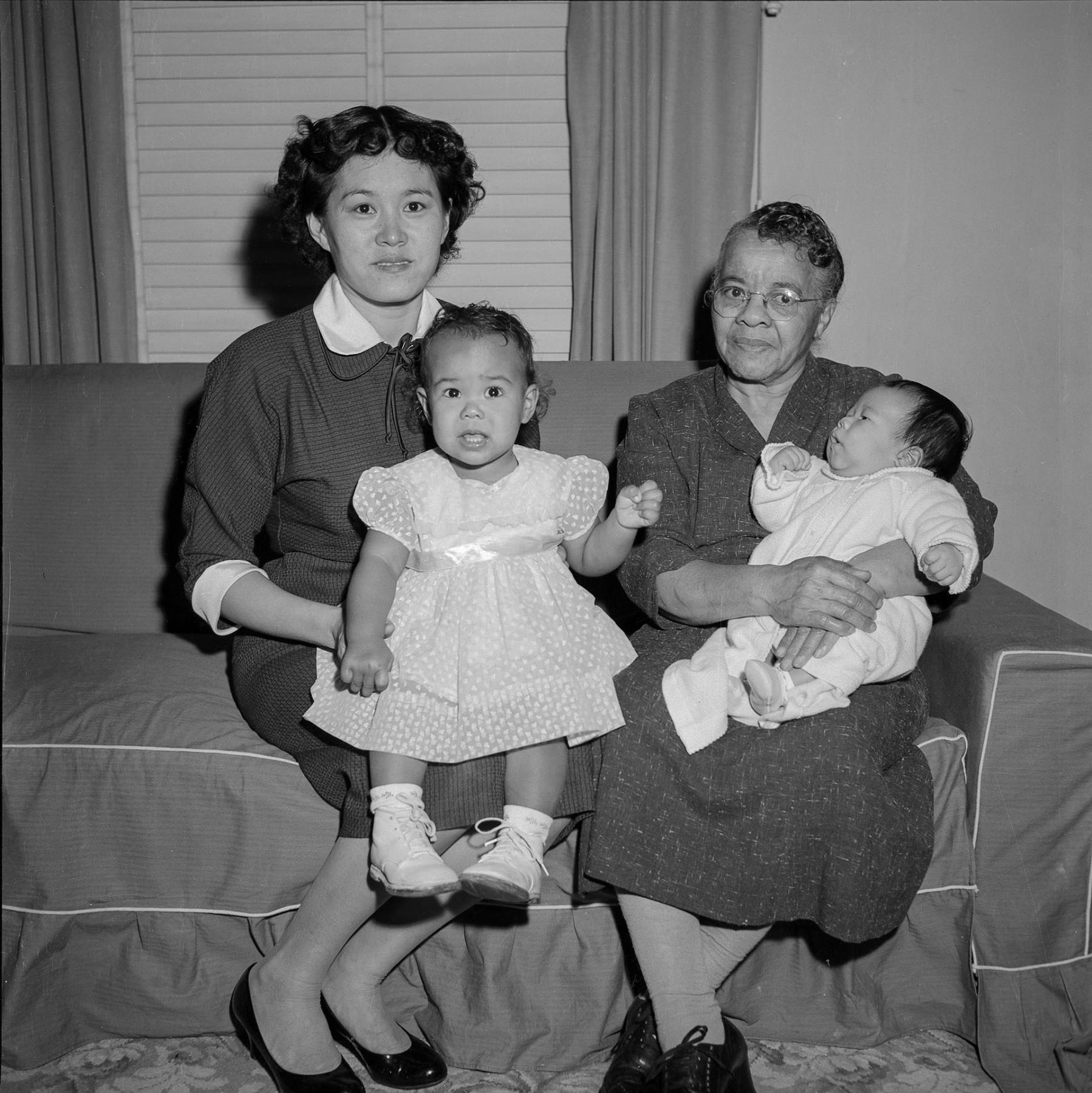 Image of Two women holding babies, Seattle, circa 1953