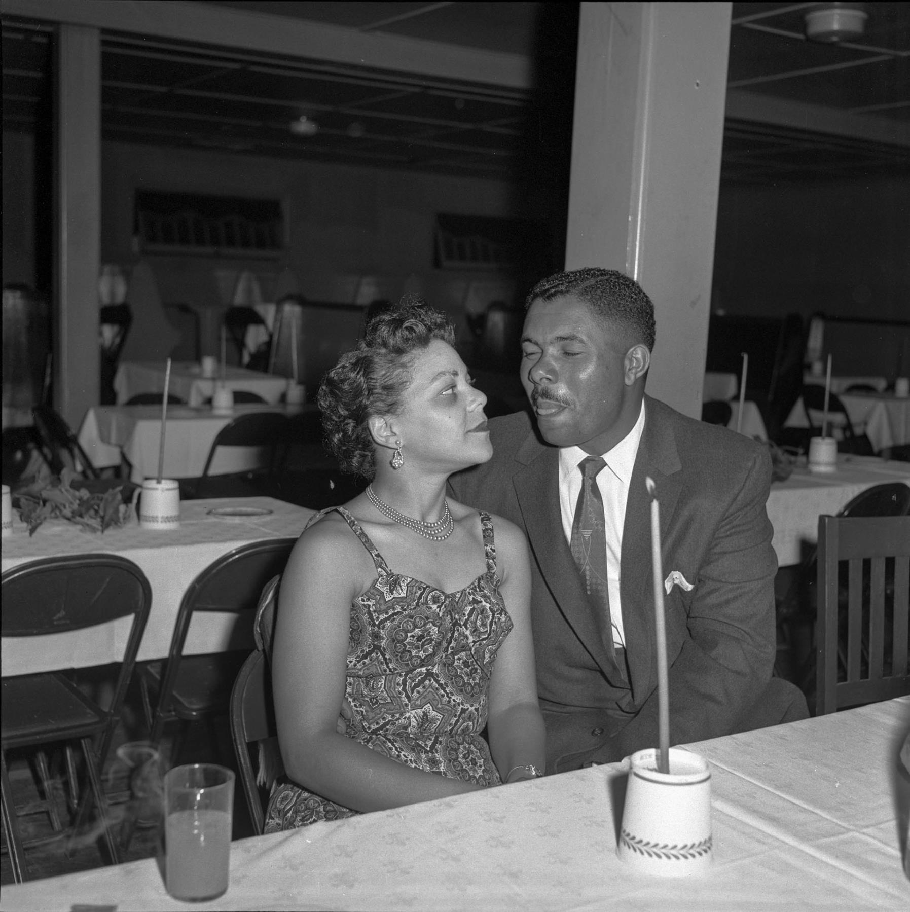 Image of Don and Shirley Phelps sitting at a table at large venue Seattle, circa 1953
