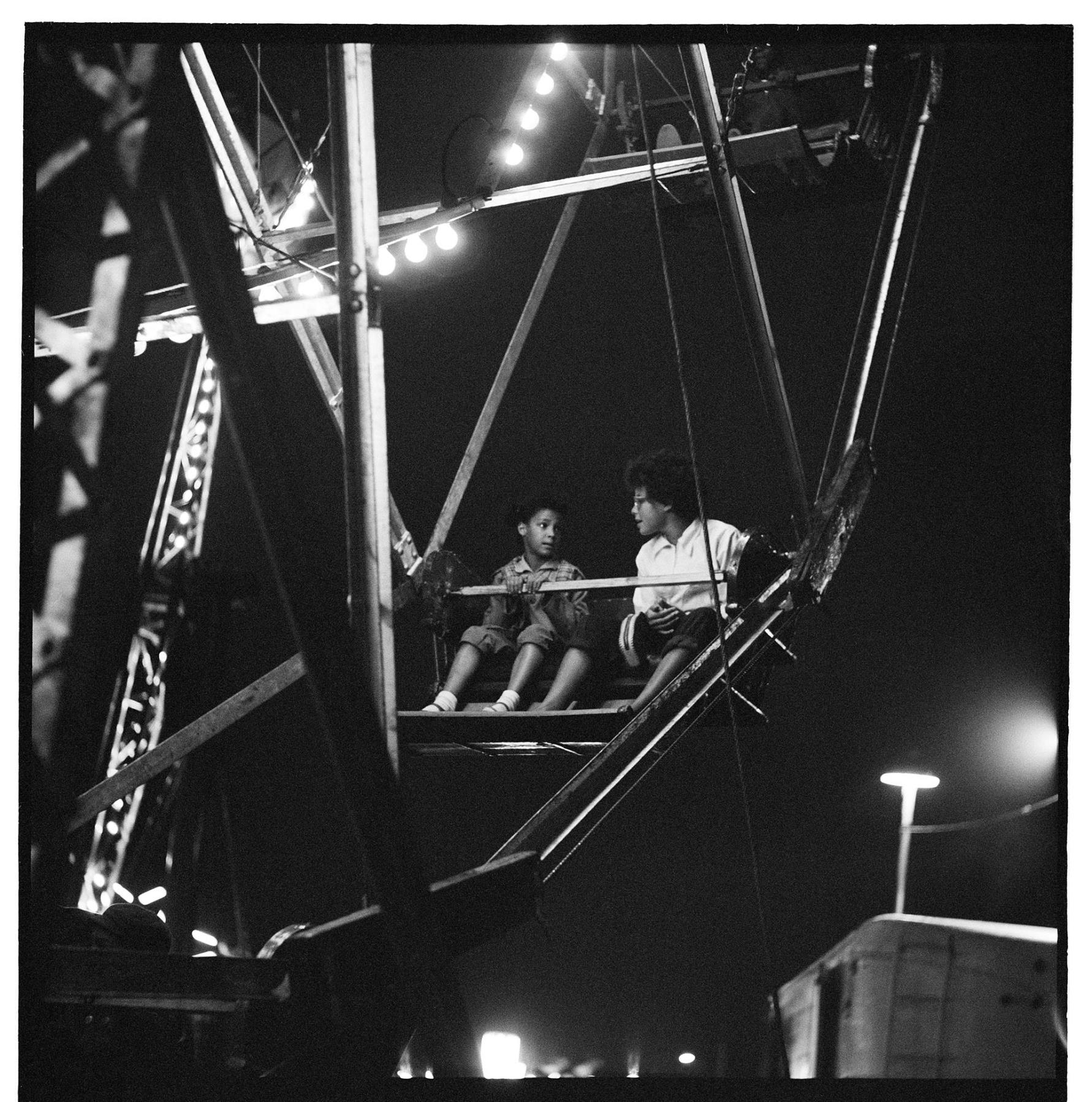 Image of Cheryl Smith and Frances Lane riding a Ferris wheel, Seattle, circa 1953