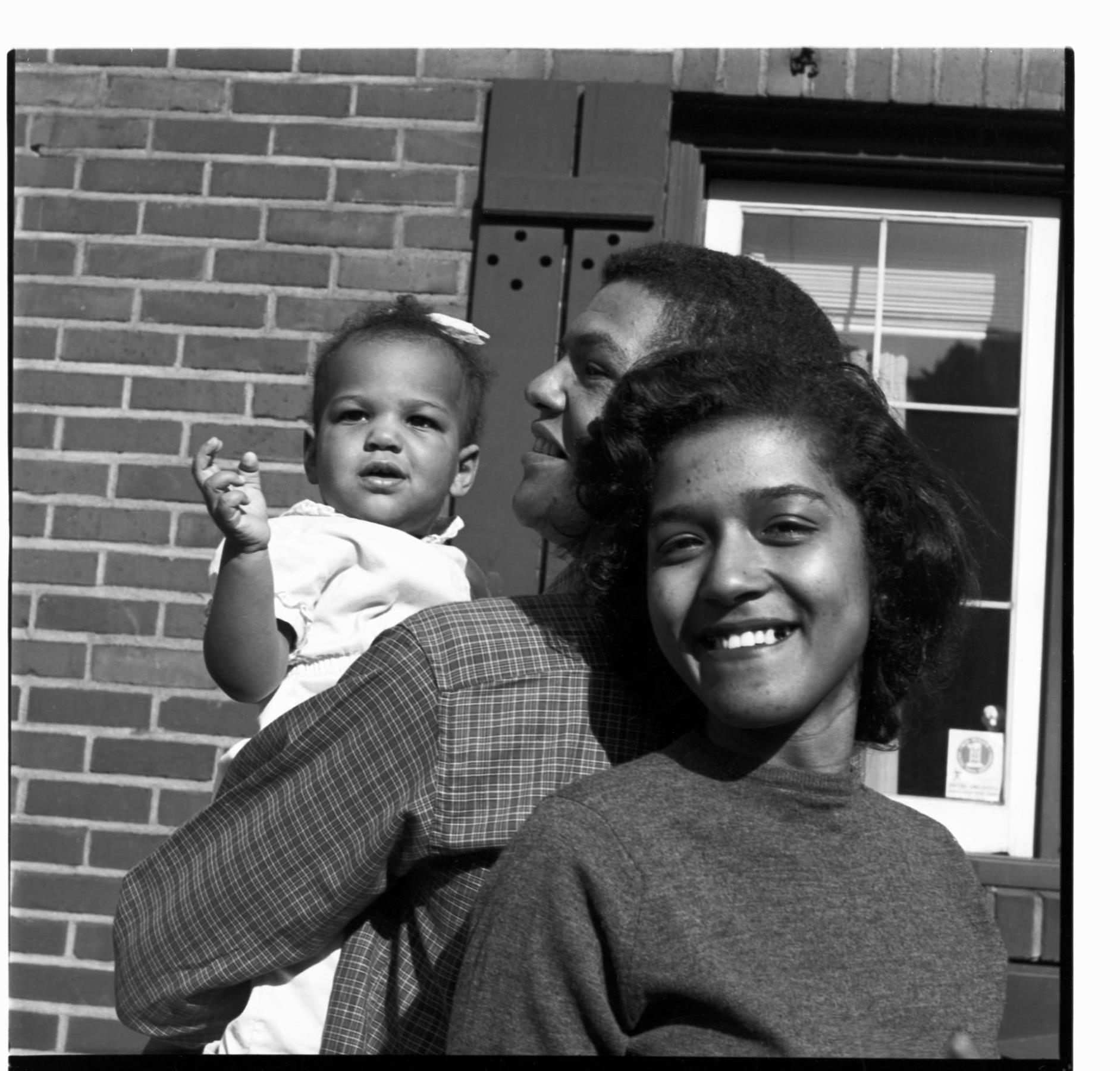 Image of Peoples family standing outside their home, Seattle, circa 1953