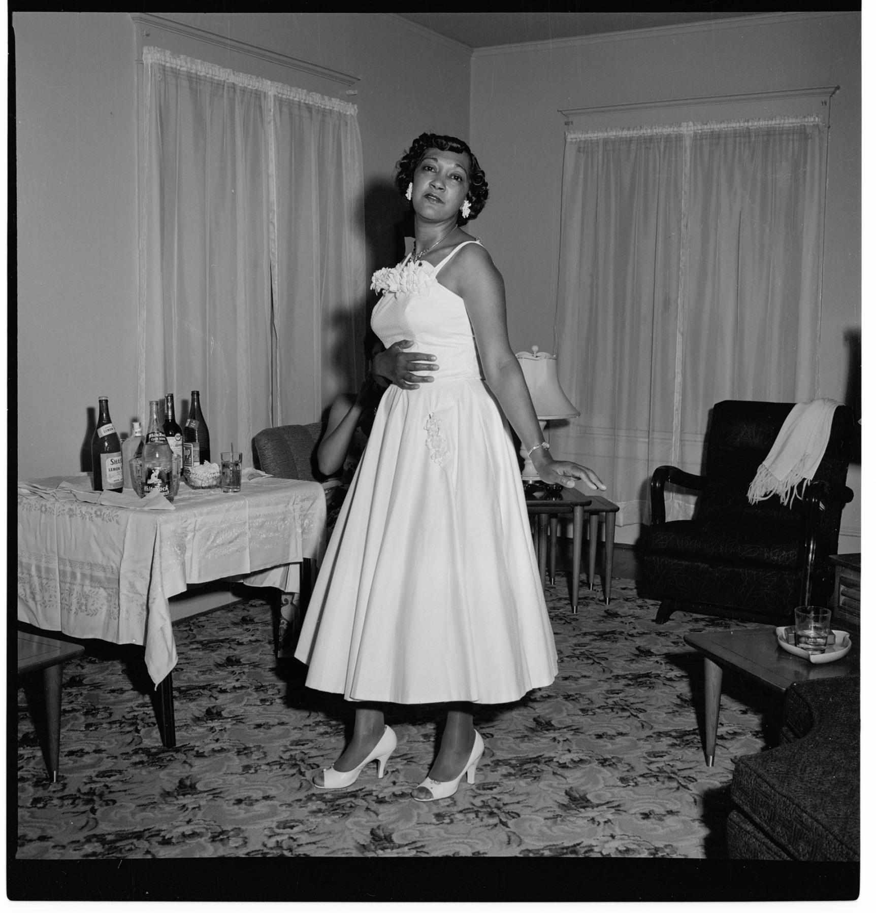 Image of Delbert Moore posing in semi-formal attire, Seattle, circa 1953