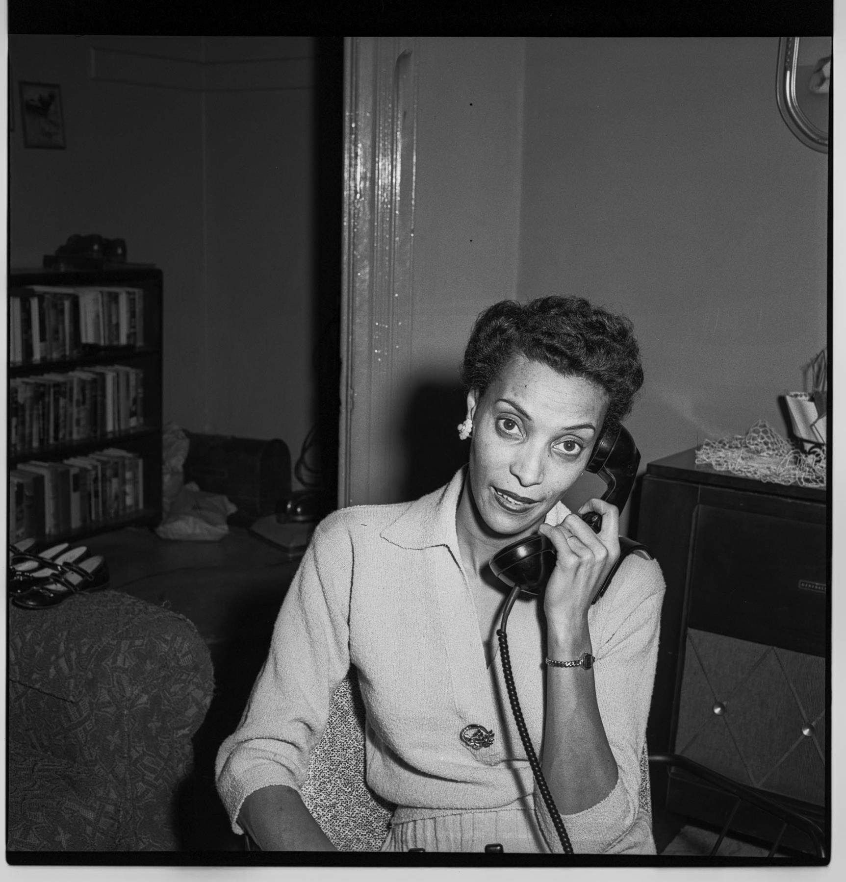Image of Izzie Smith talking on the phone, Seattle, circa 1953