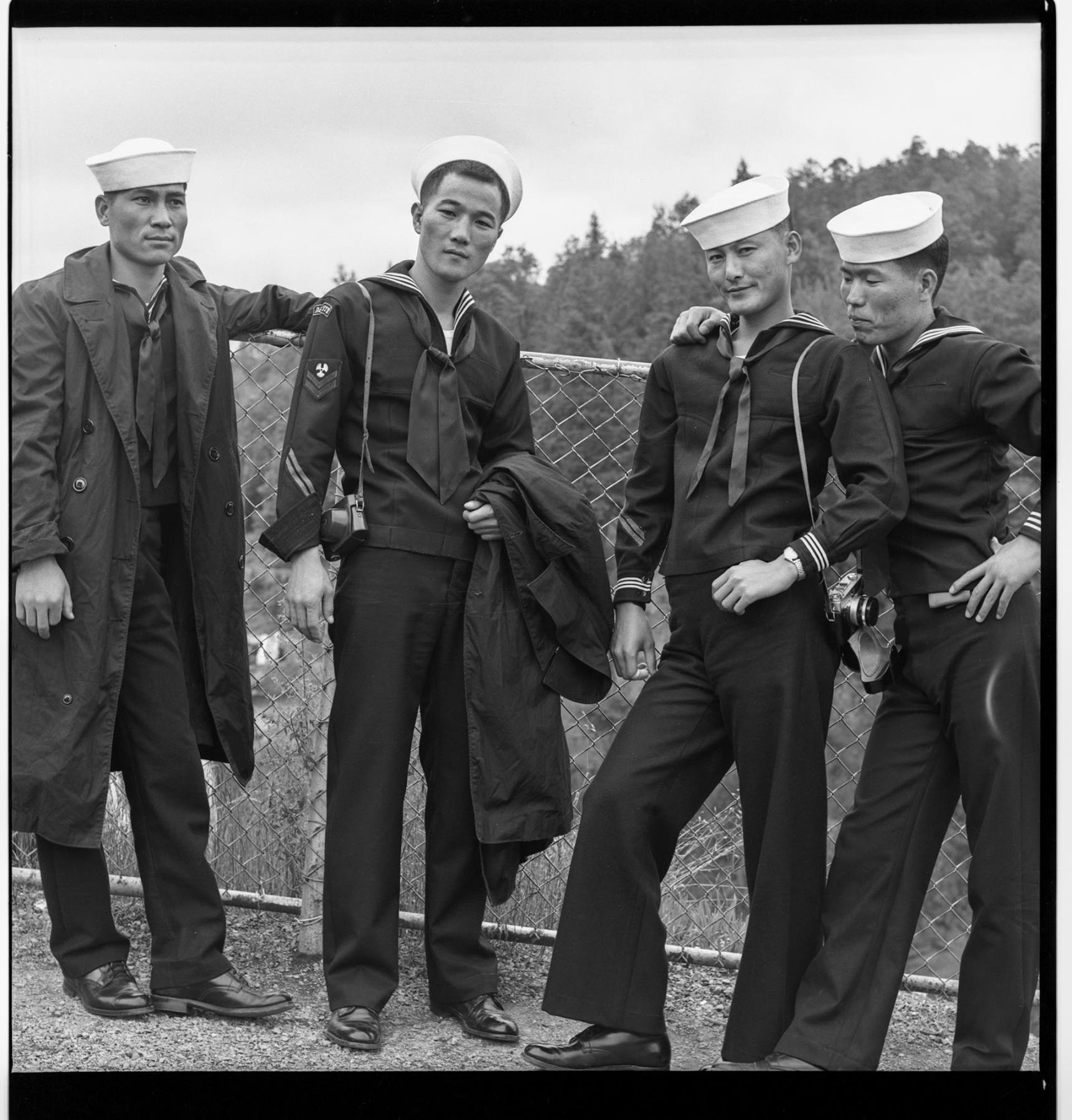 Image of Four Asian sailors posing in uniform, Seattle, circa 1953