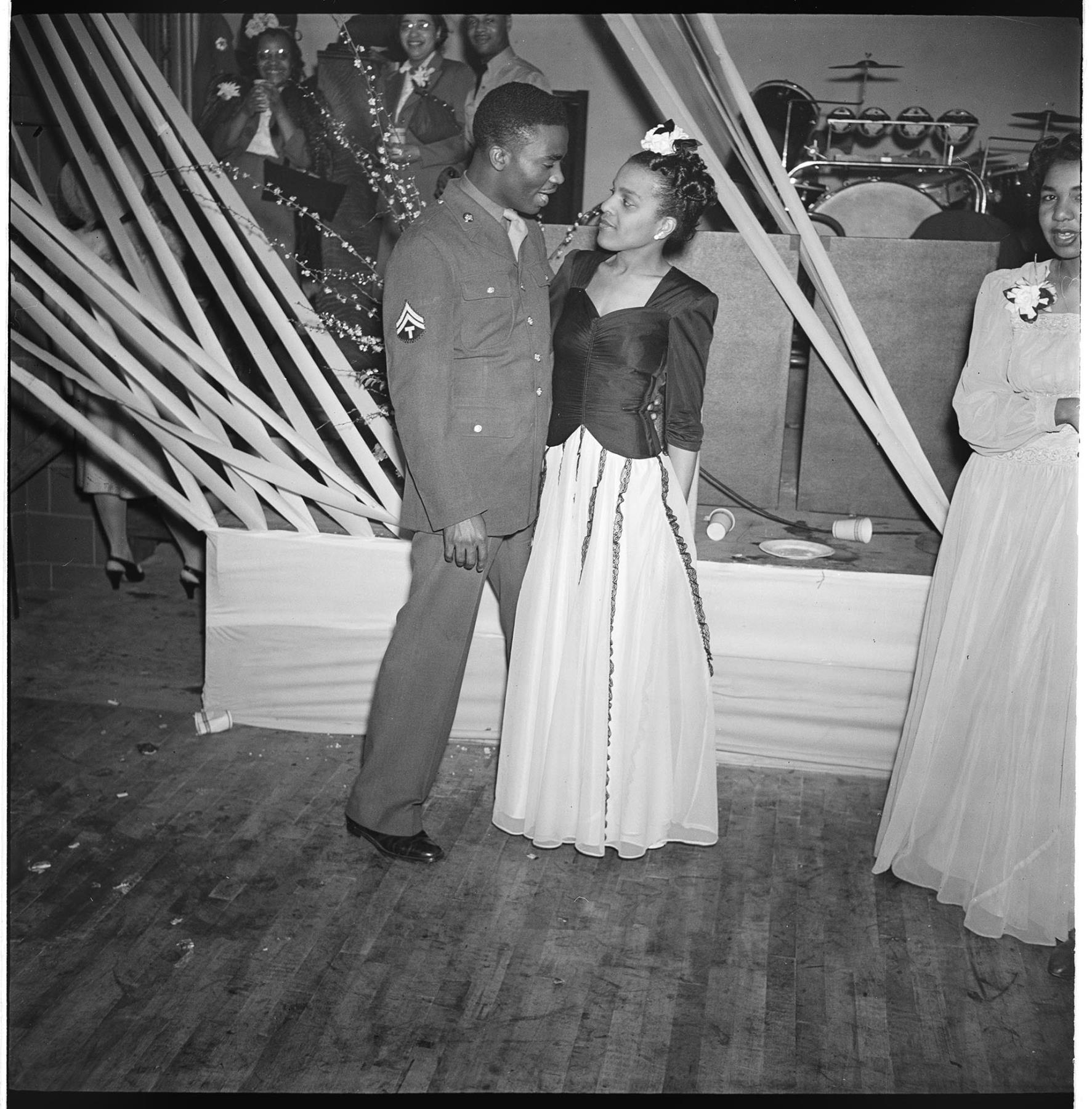 Image of A couple standing near bandstand , Seattle, circa 1953