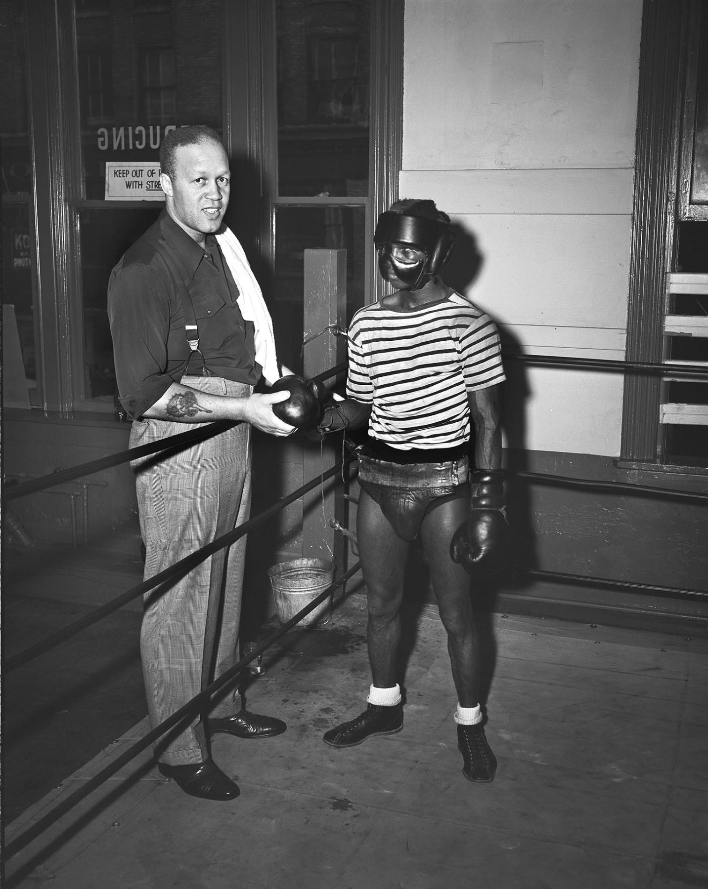 Image of Bob Frasier and John Davis posing at gym, Seattle, October 16, 1949