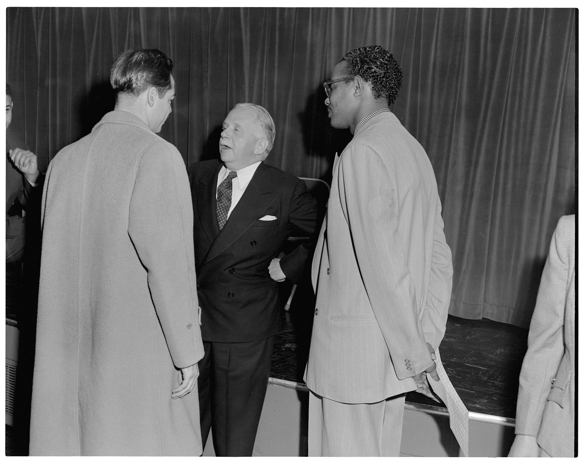 Image of Phil Burton and Walter White talking with Bill Ross, Seattle, November 20, 1949