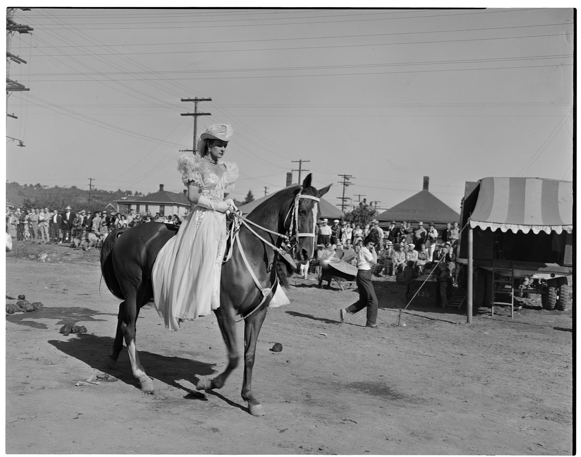 Image of Circus equestrienne riding a horse, Seattle, September 11, 1949