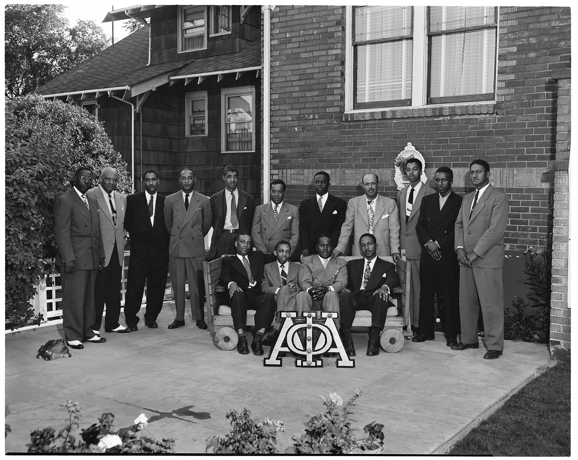 Image of Fraternity brothers posing with house letters, Seattle, July 10, 1949
