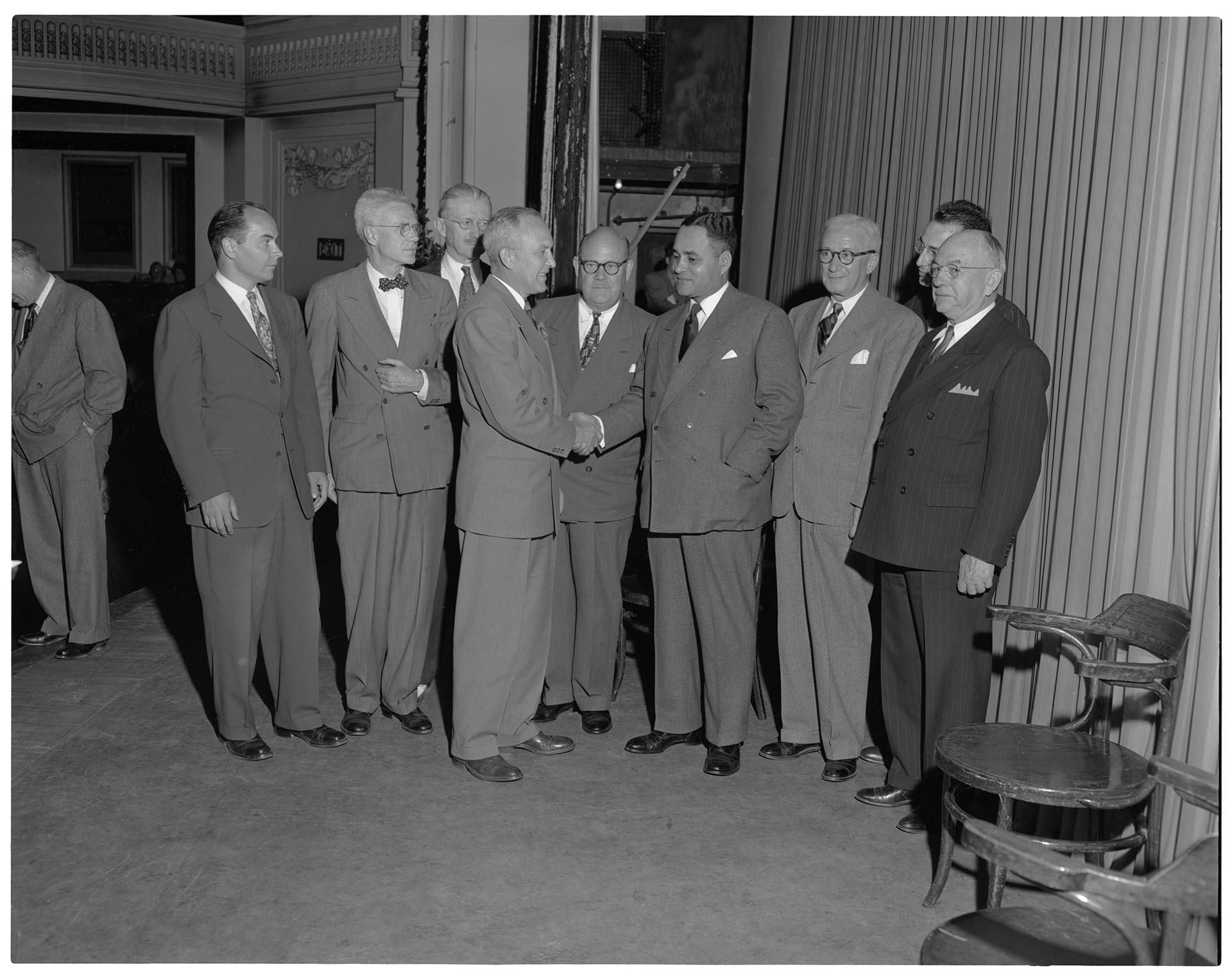 Image of Dr. Ralph Bunche and others greeting Governor Langlie, Seattle, July 7, 1949