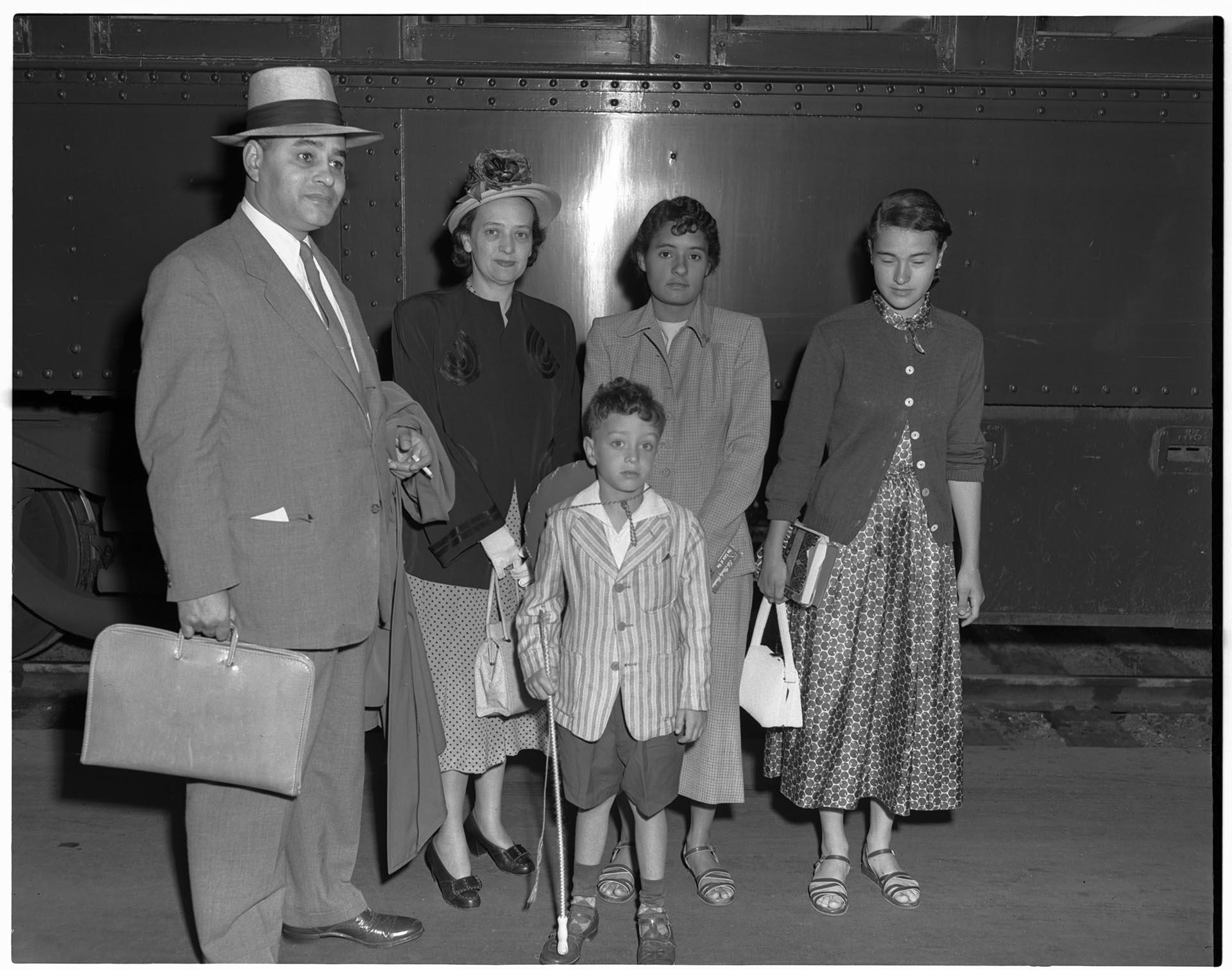 Image of Dr. Ralph Bunche and family on train platform, Seattle, July 7, 1949