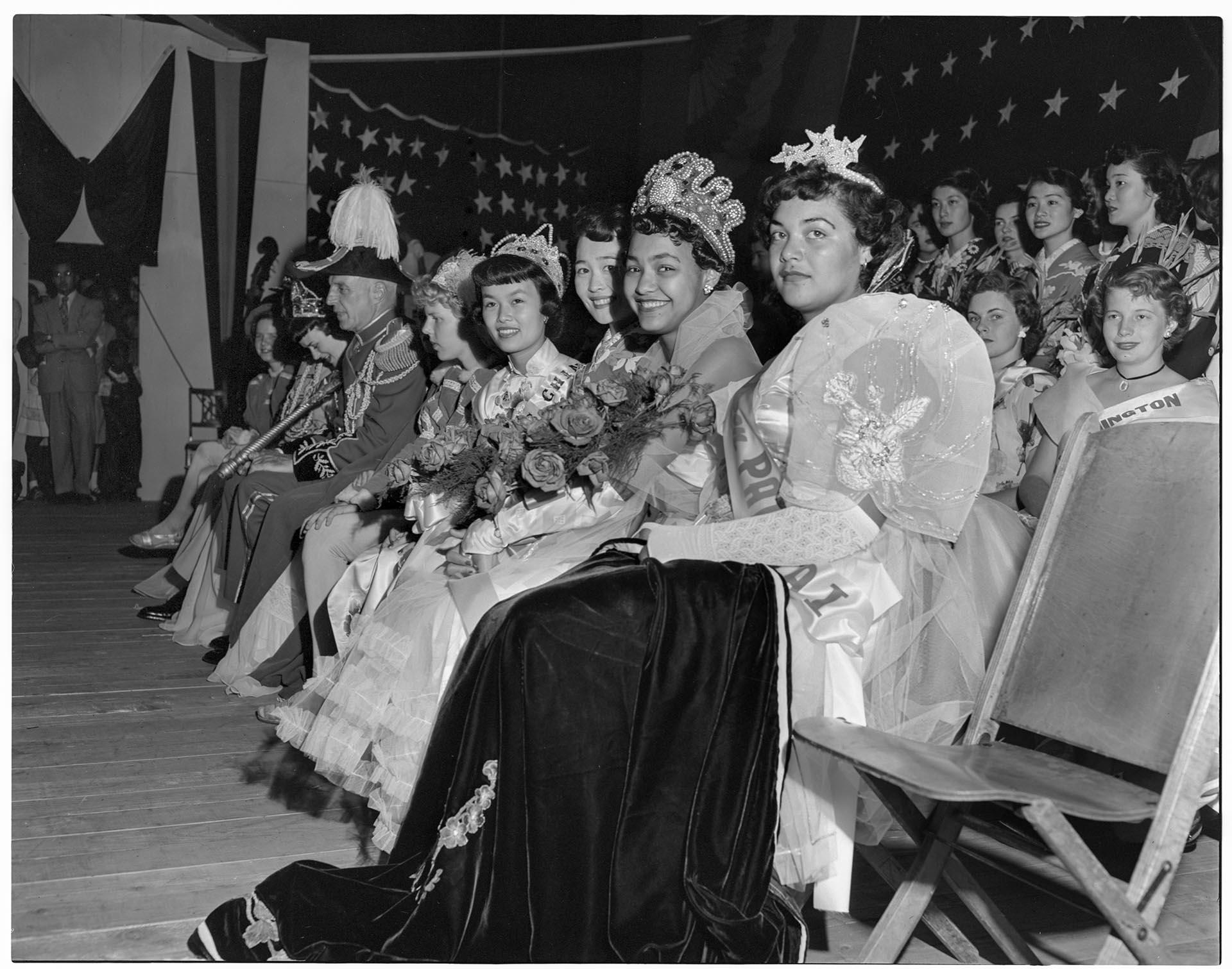 Image of Group sitting during International Carnival, Seattle, circa 1949