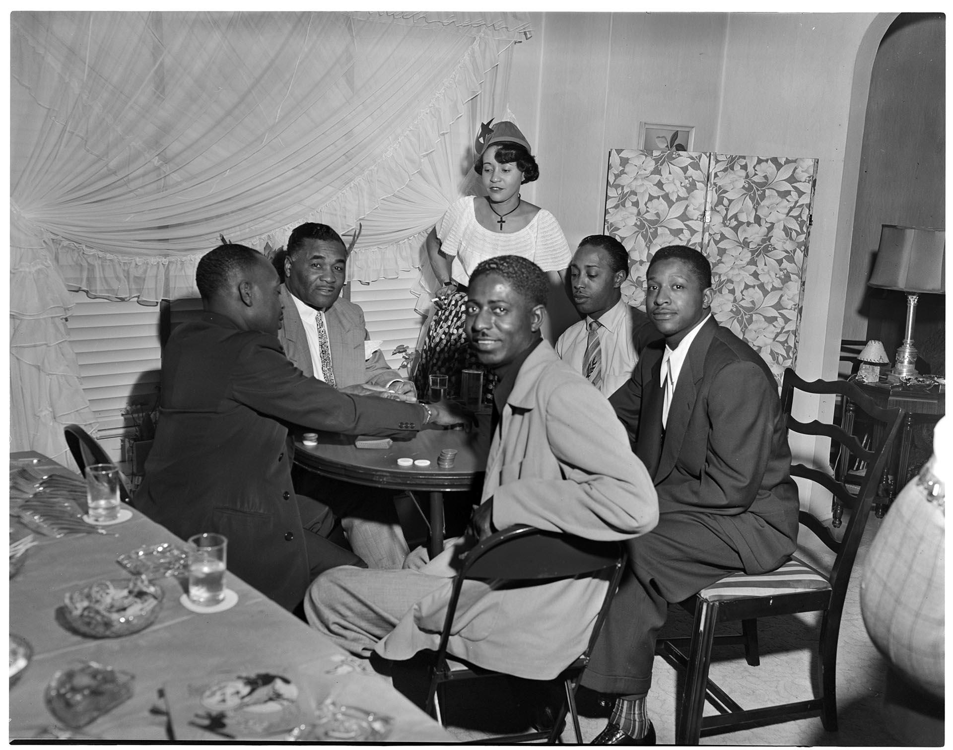 Image of Partygoers playing poker, Seattle, circa 1950