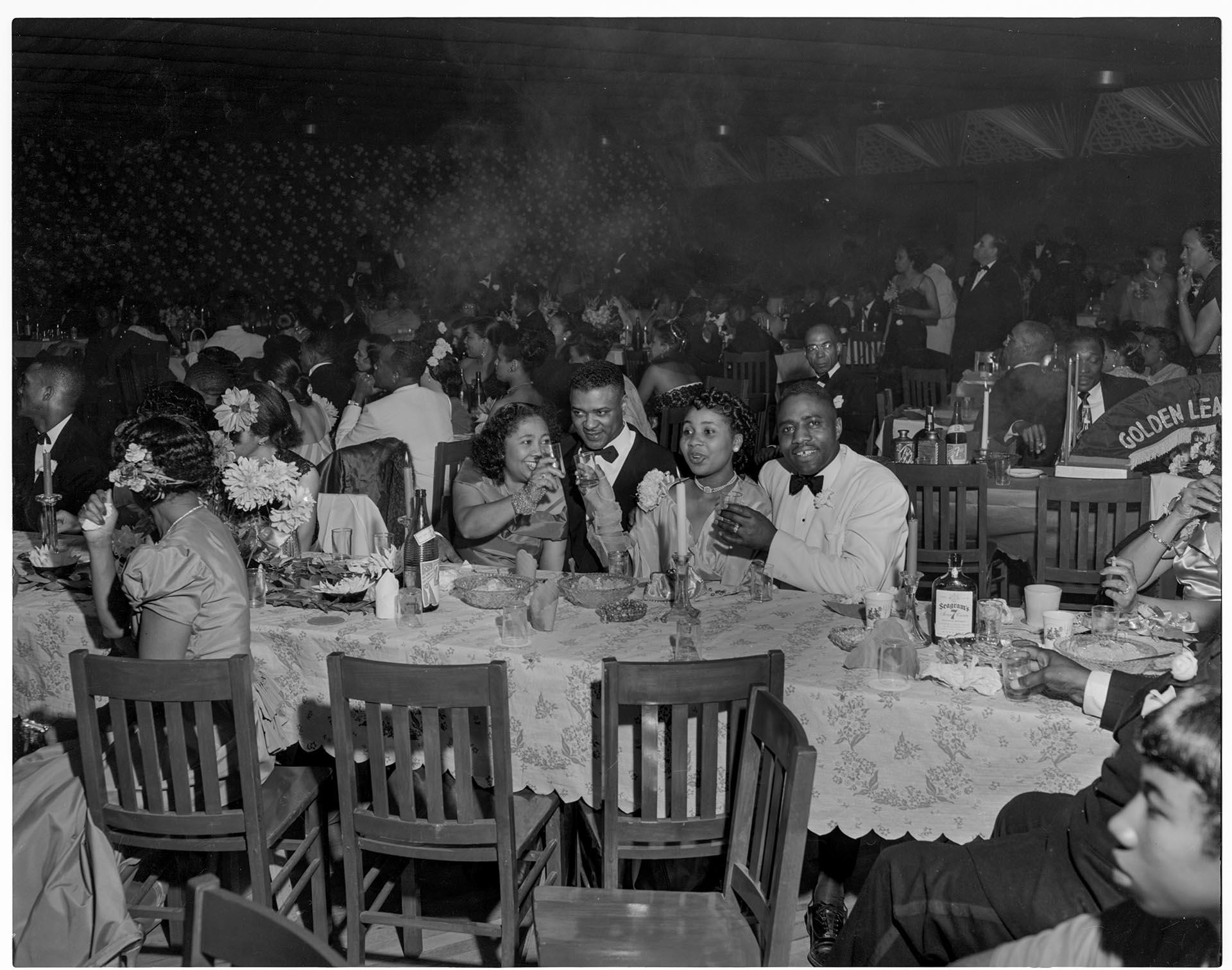 Image of Clubgoers toasting at the Black and Tan Club, Seattle, circa 1950