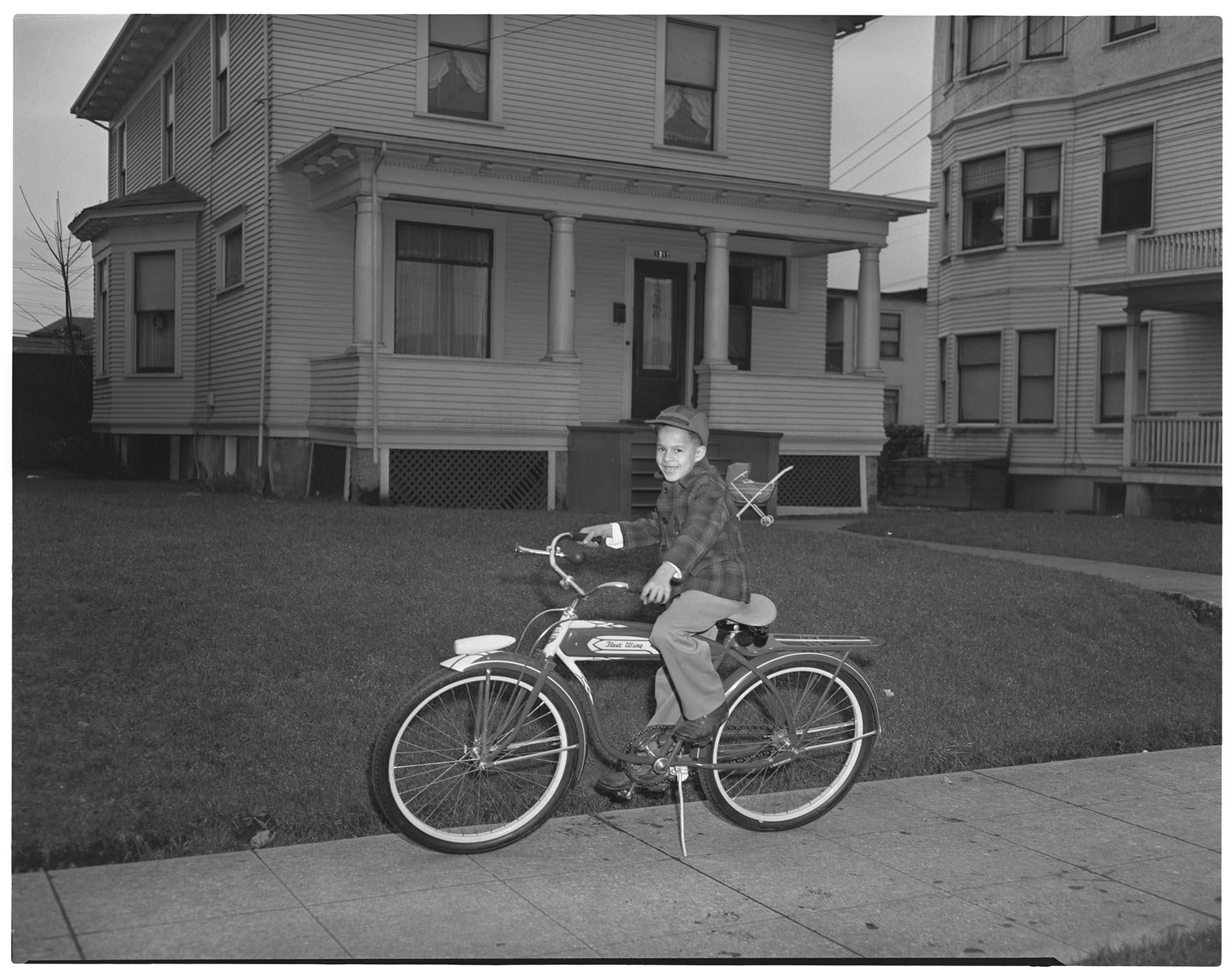 Image of Boy posing on a bicycle, Seattle, circa 1950