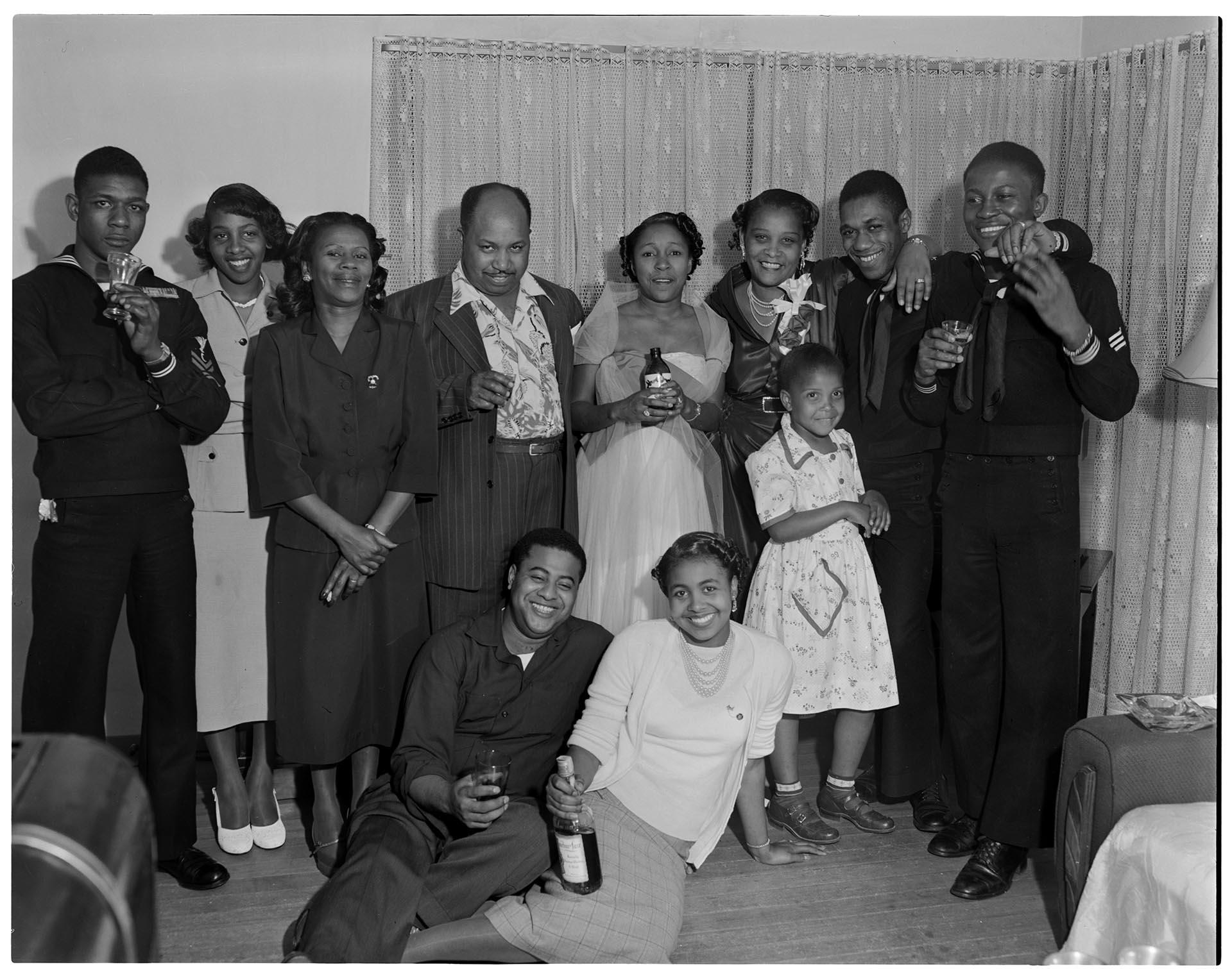 Image of Partygoers posing inside home, Seattle, circa 1950