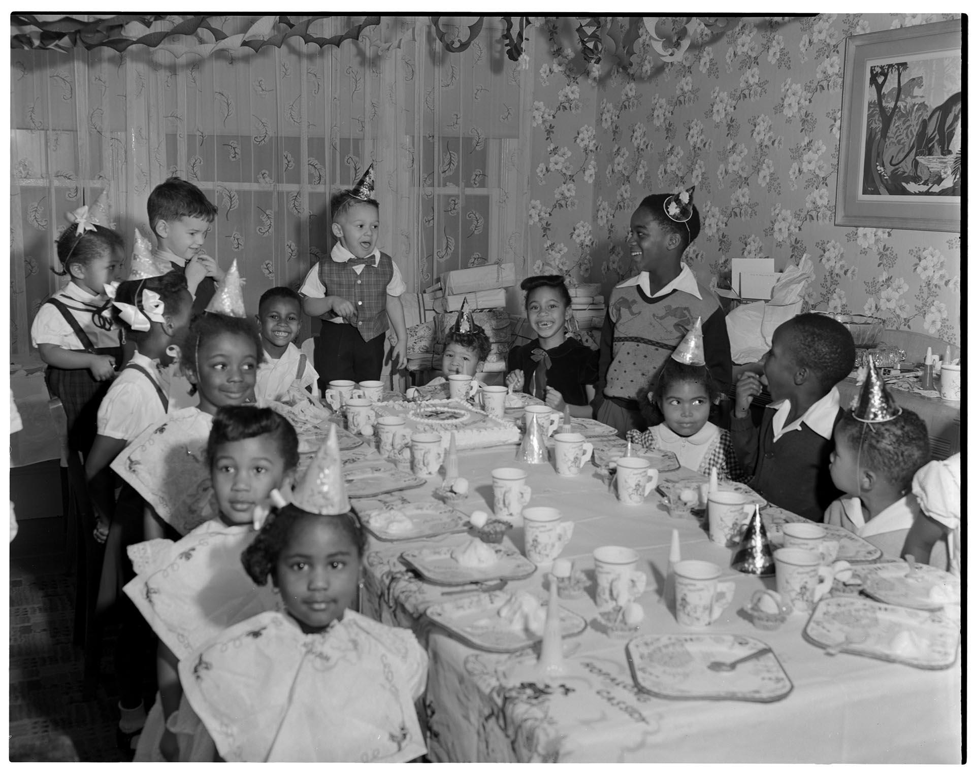 Image of Children around table at birthday party, Seattle, circa 1955