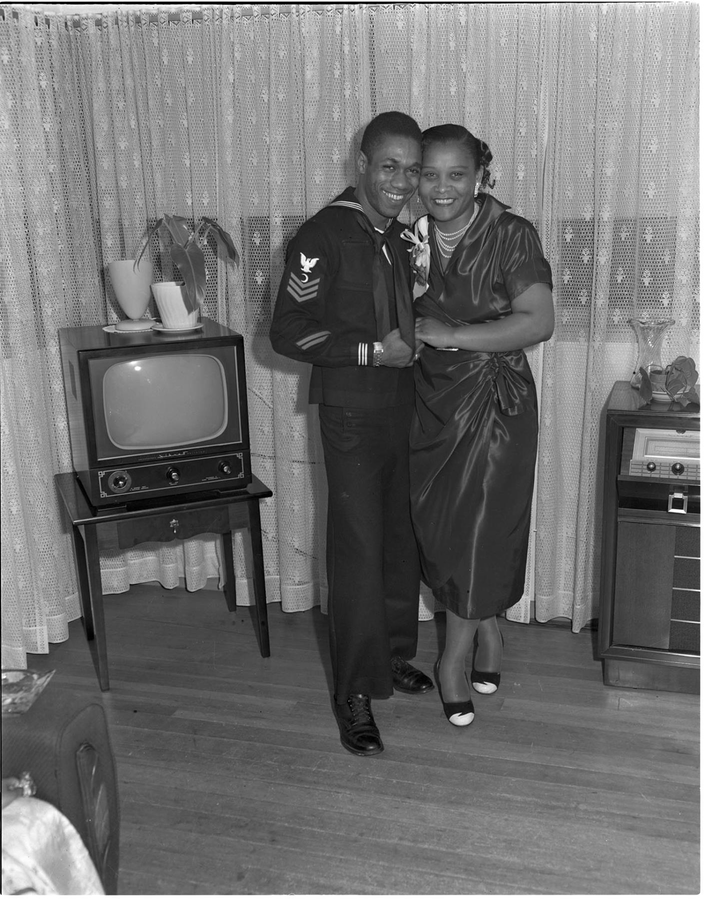Image of Couple posing in a living room, Seattle, circa 1950