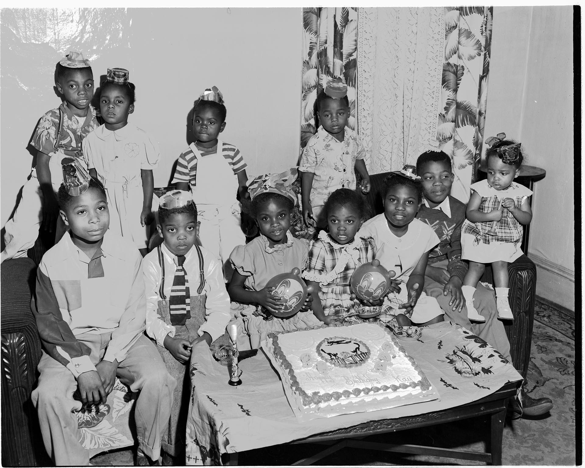 Image of Birthday girl and friends on couch, Seattle, circa 1953