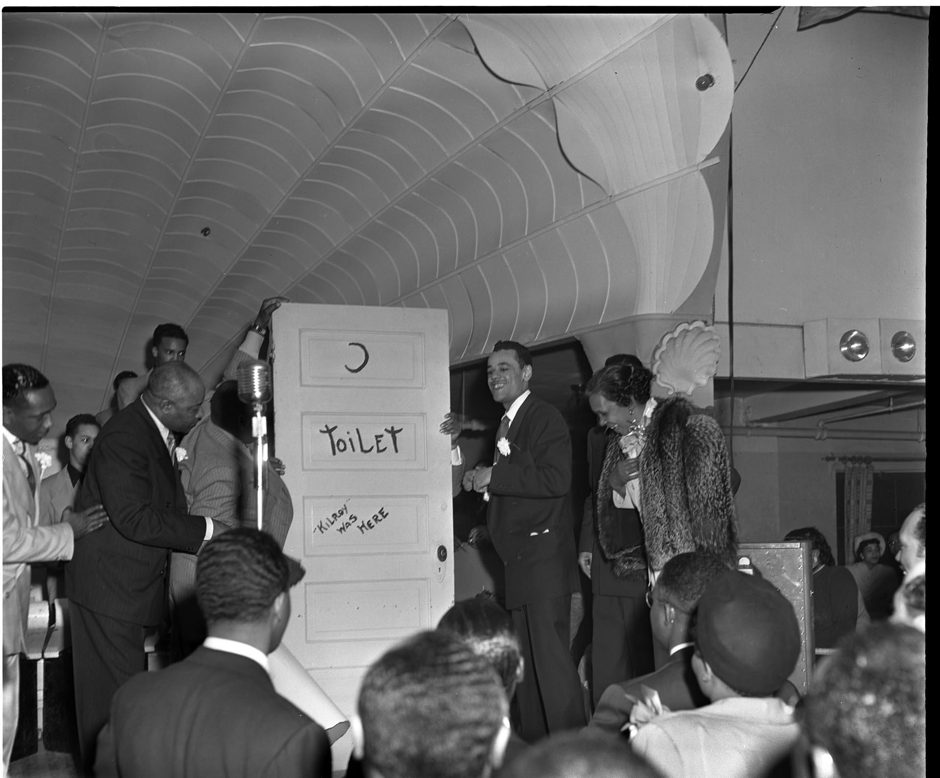 Image of Crowd watching presenters on stage at the Trianon, Seattle, April 9, 1950