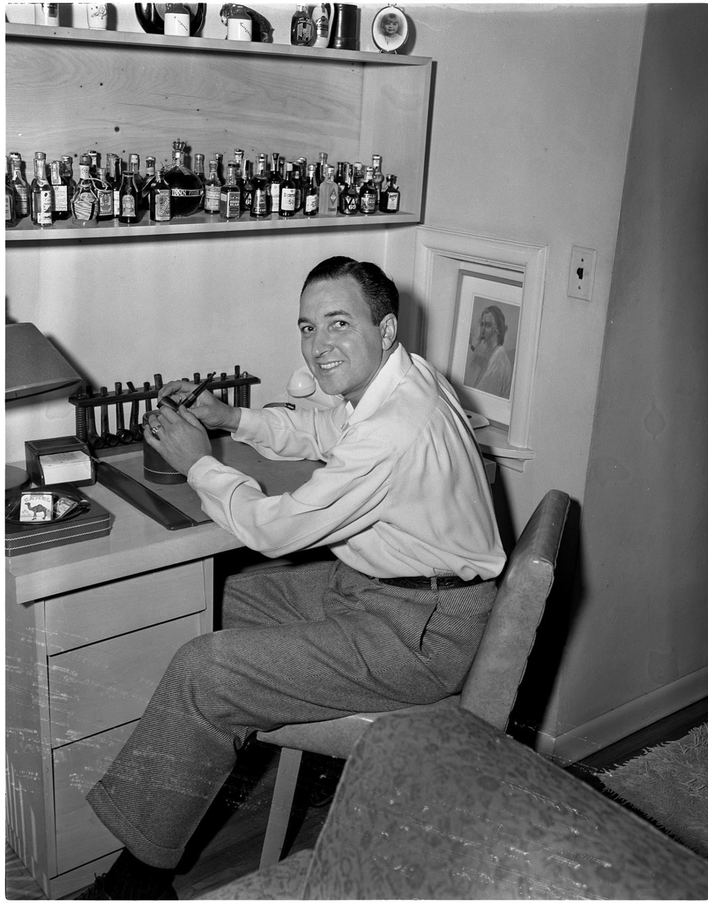 Image of Italian Club president sitting at desk, Seattle, circa 1953