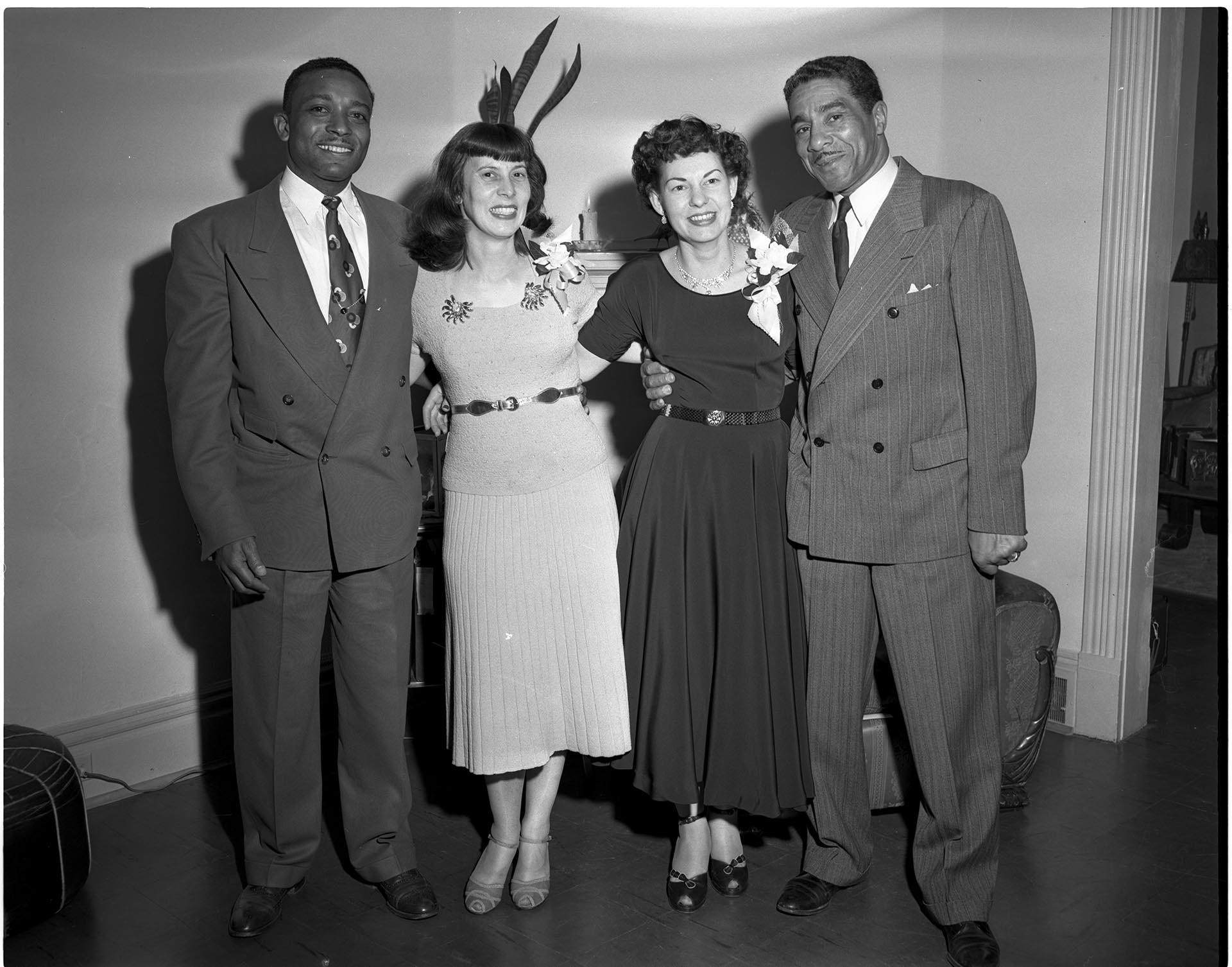 Image of Two couples posing in living room, Seattle, circa 1953