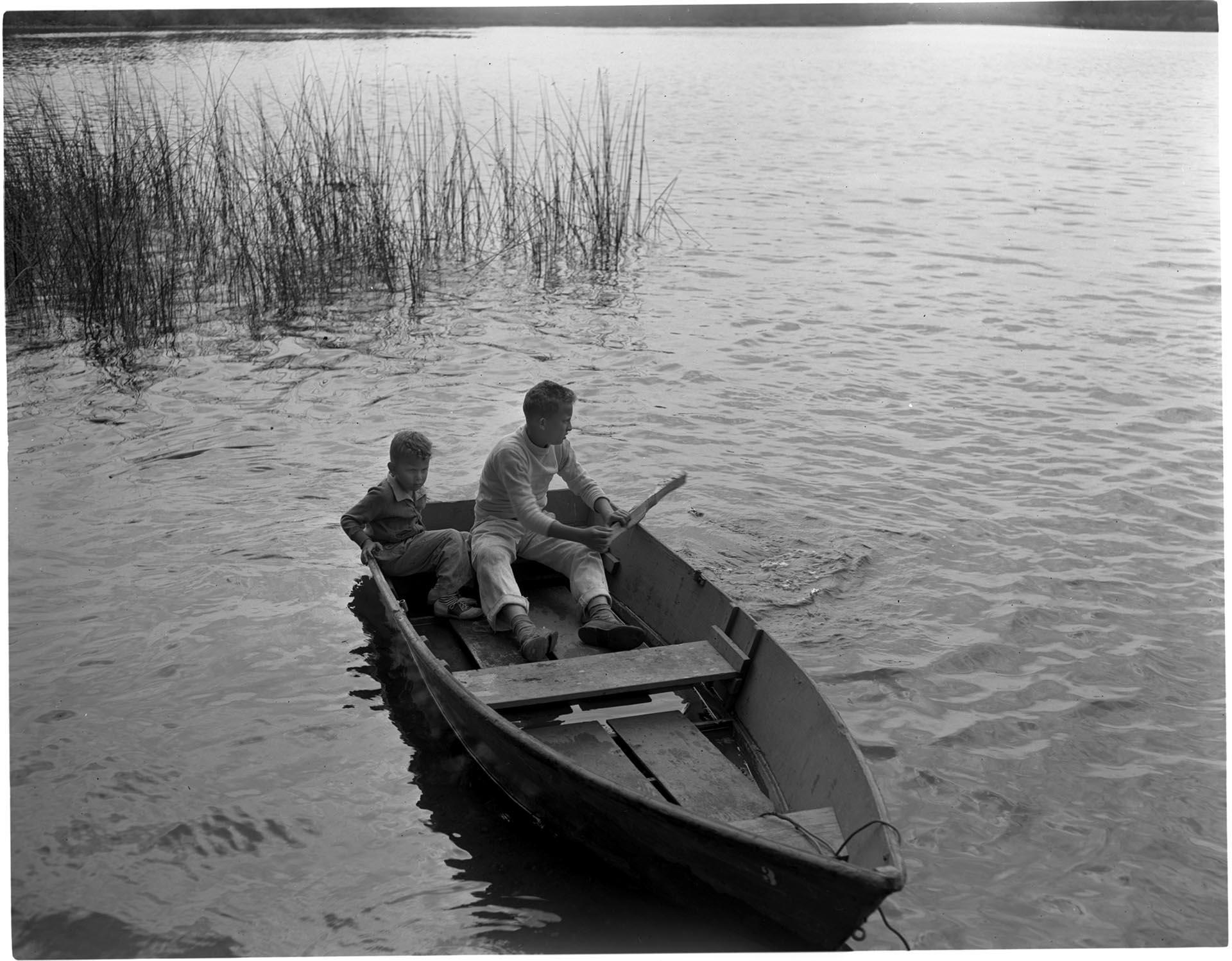 Image of Butch Smith and Sonny Norris sitting in rowboat, Seattle, July 4th, 1947