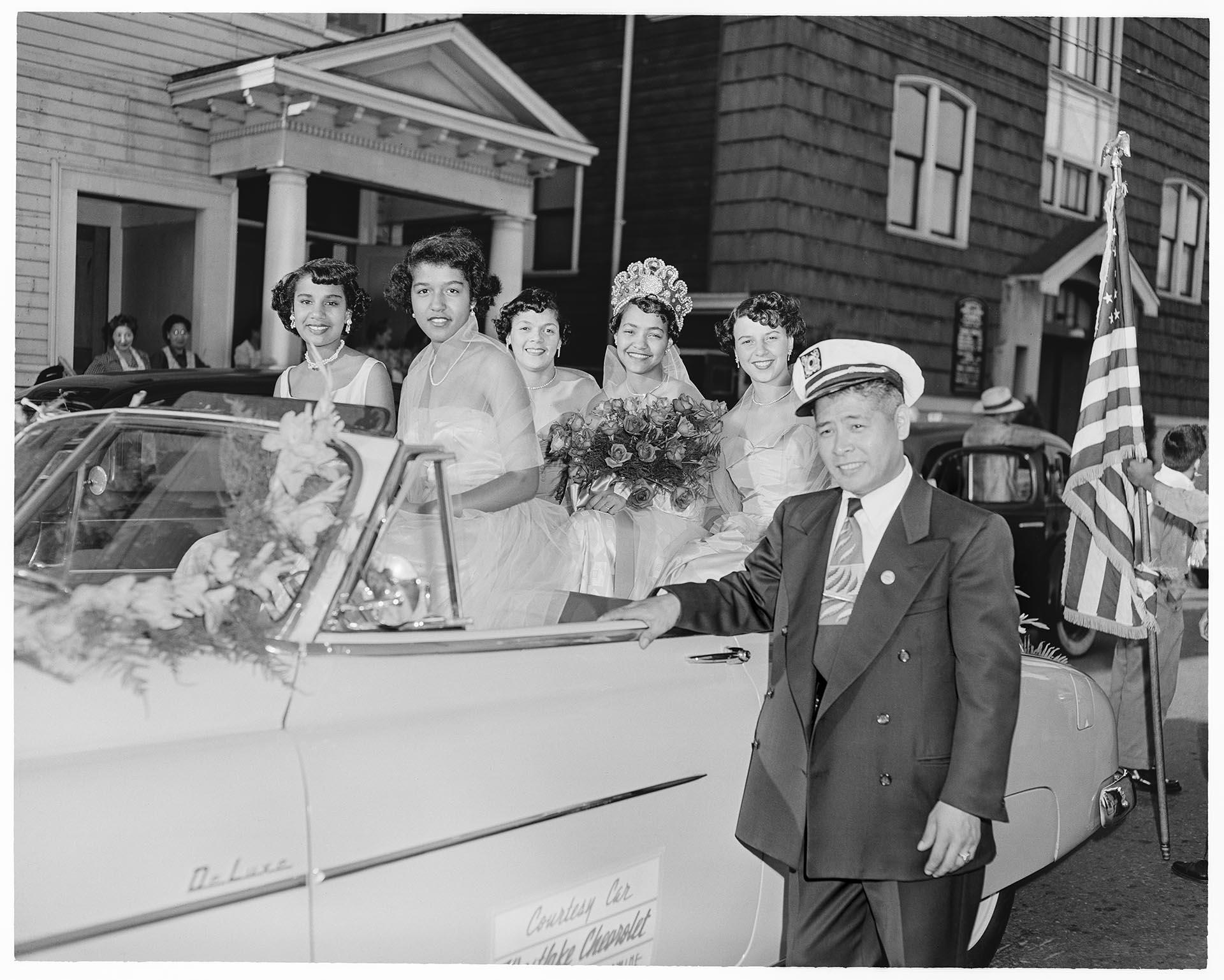 Image of Black community Queen and princesses  riding in Seafair International Parade, Seattle, circa 1953