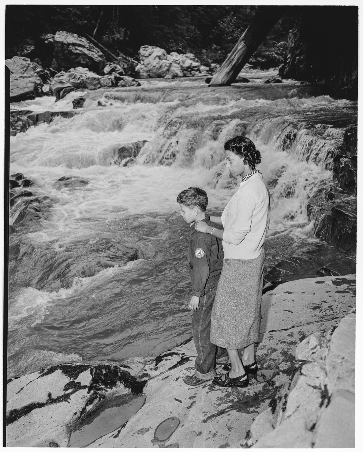 Image of Izzy and Butch Smith standing on rocks, Granite Falls, circa 1953