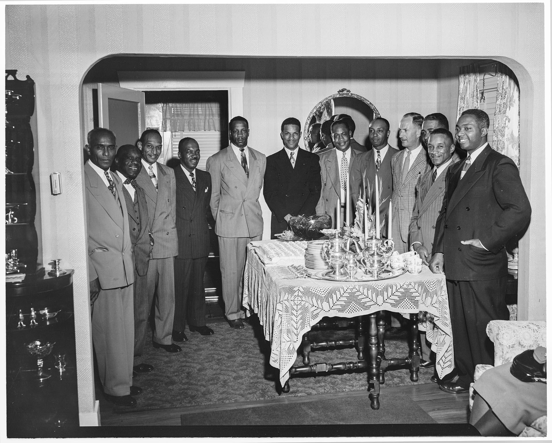 Image of Men around table at Wiseman party, Seattle, circa 1953