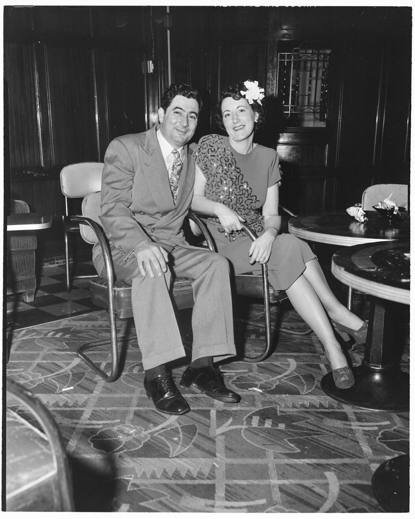 Image of Man and woman sitting at Italian Club, Seattle, circa 1953