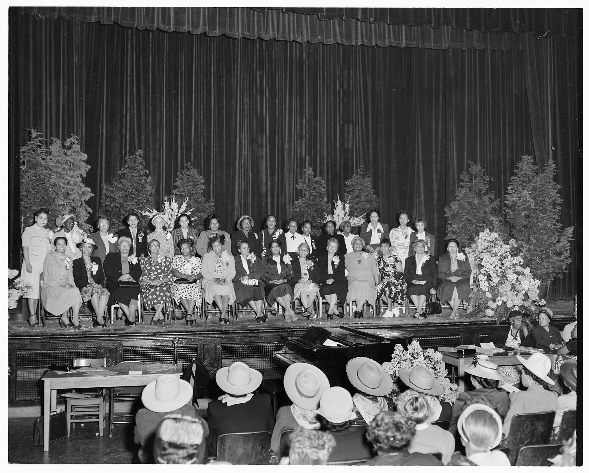 Image of NACWC convention delegates sitting on stage, Seattle, August 1948