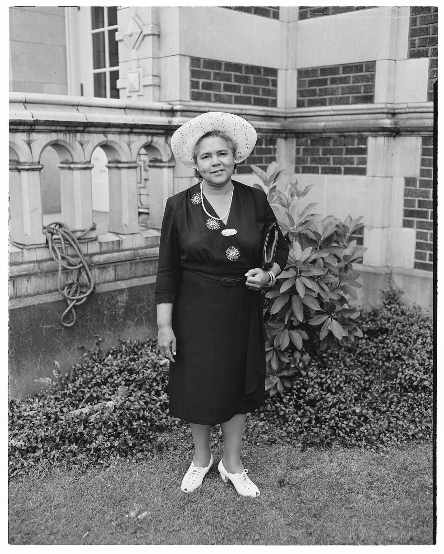 Image of NACWC convention delegate in front of Garfield High School, Seattle, August 1948