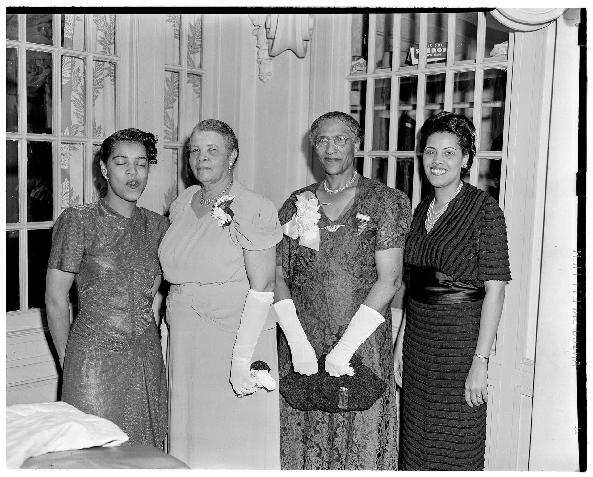 Image of Four NACWC delegates at convention,  Seattle, August 1948