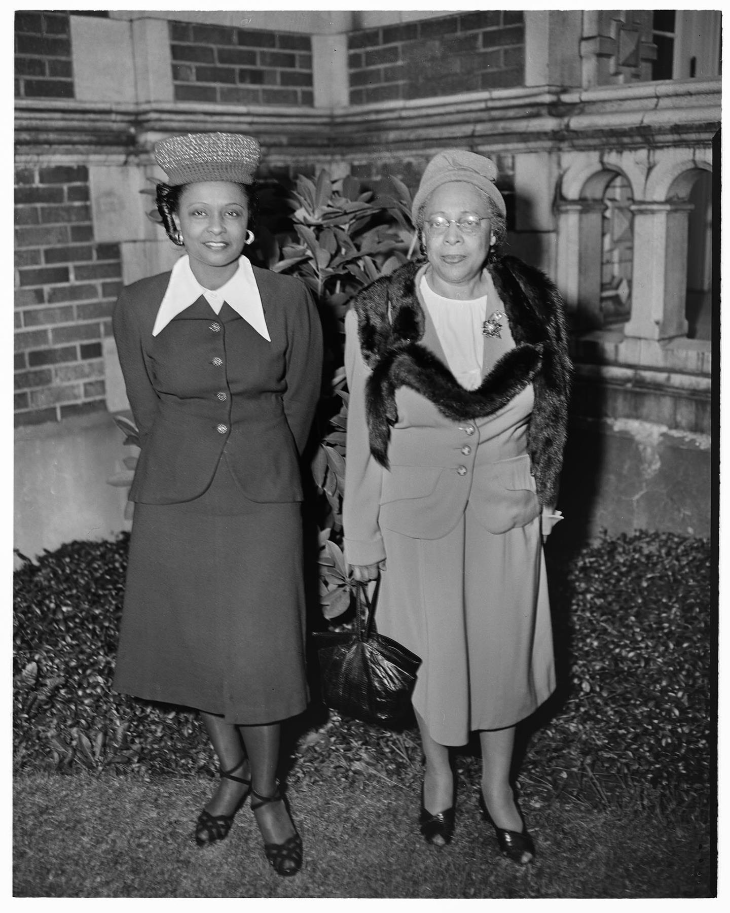 Image of Two NACWC convention delegates in front of Garfield High School, Seattle, August 1948