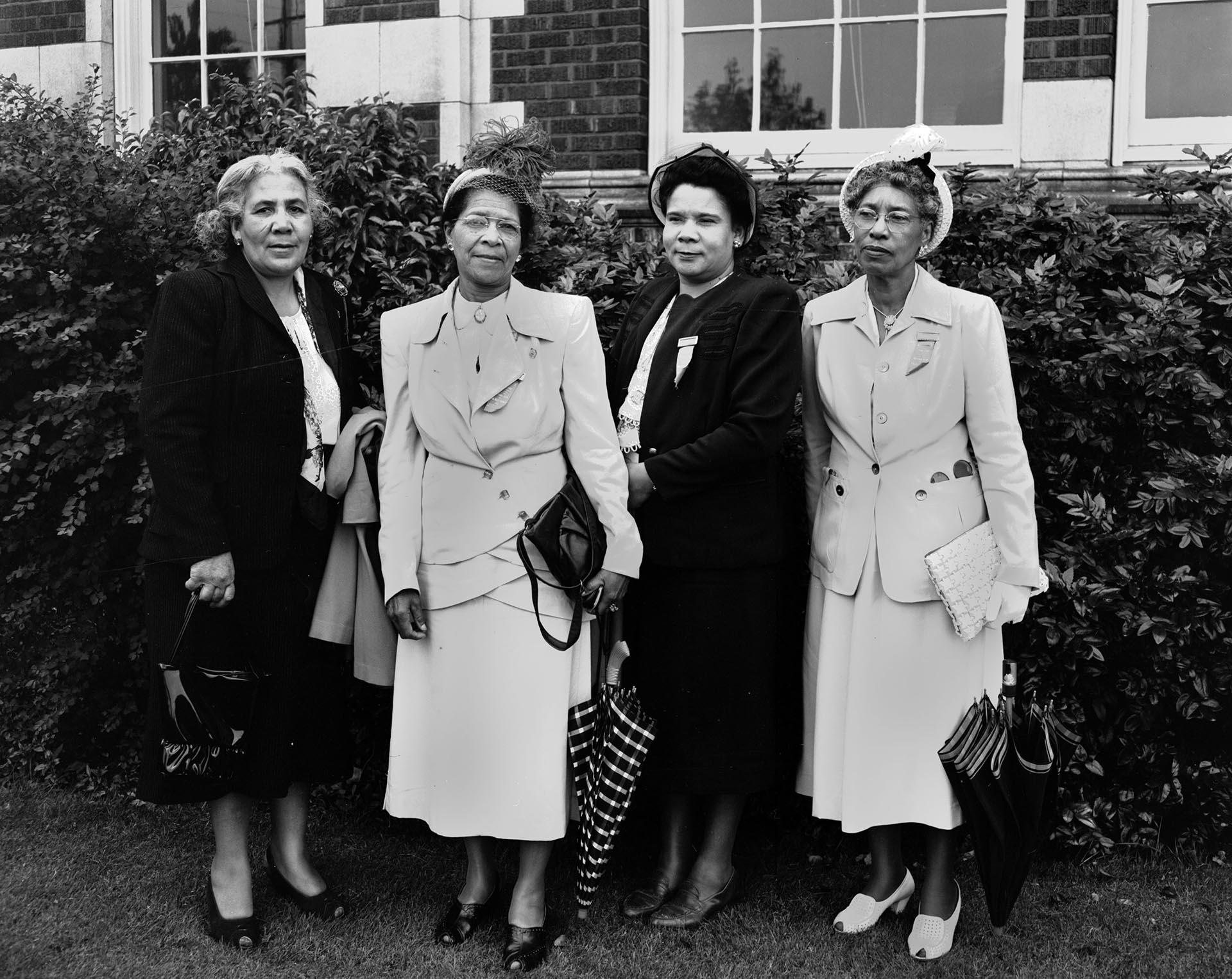 Image of Four NACWC convention delegates in front of Garfield High School, Seattle, August 1948