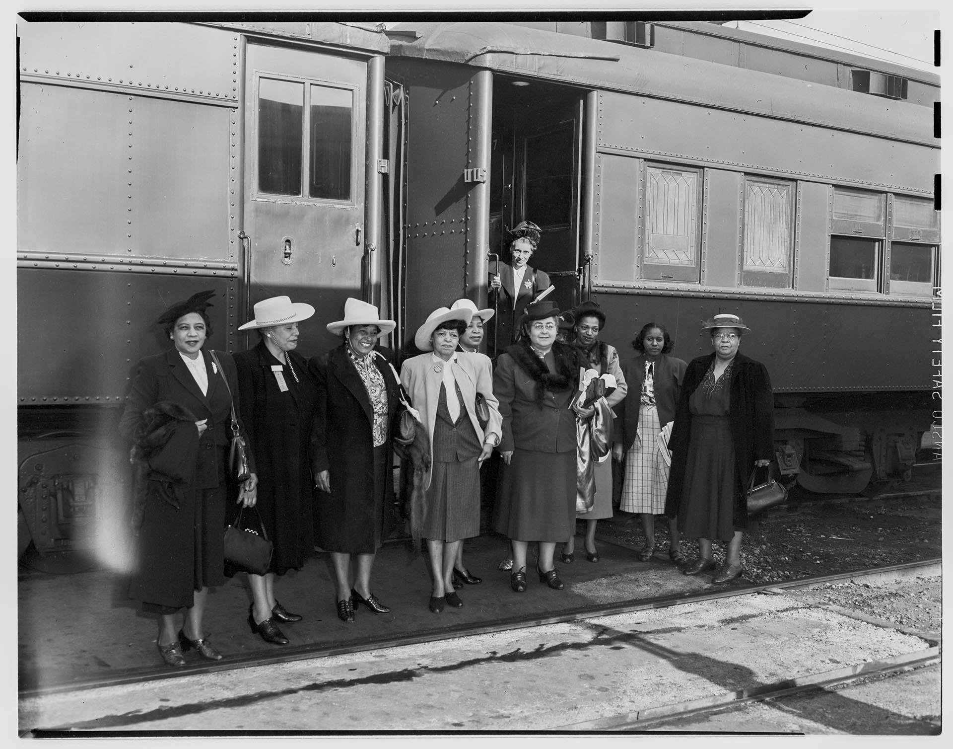 Image of NACWC convention delegates near train at King Street Station, Seattle, August 1948