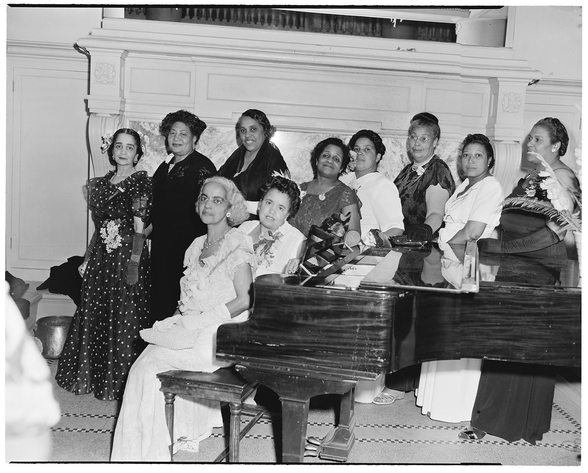 Image of NACWC convention delegates around piano, Seattle, August 1948