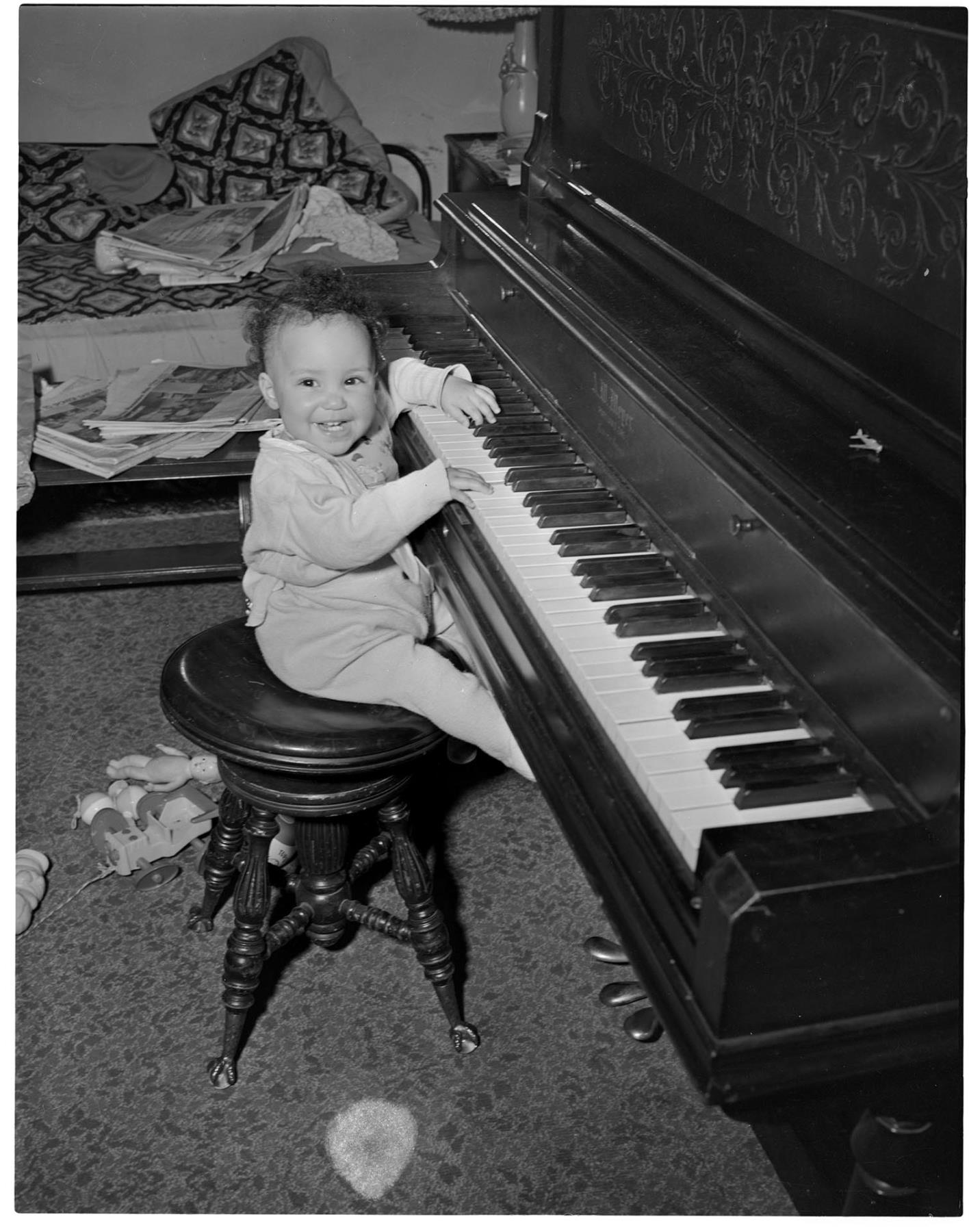 Image of Cheryl Inez Smith playing the piano, Seattle, circa 1955