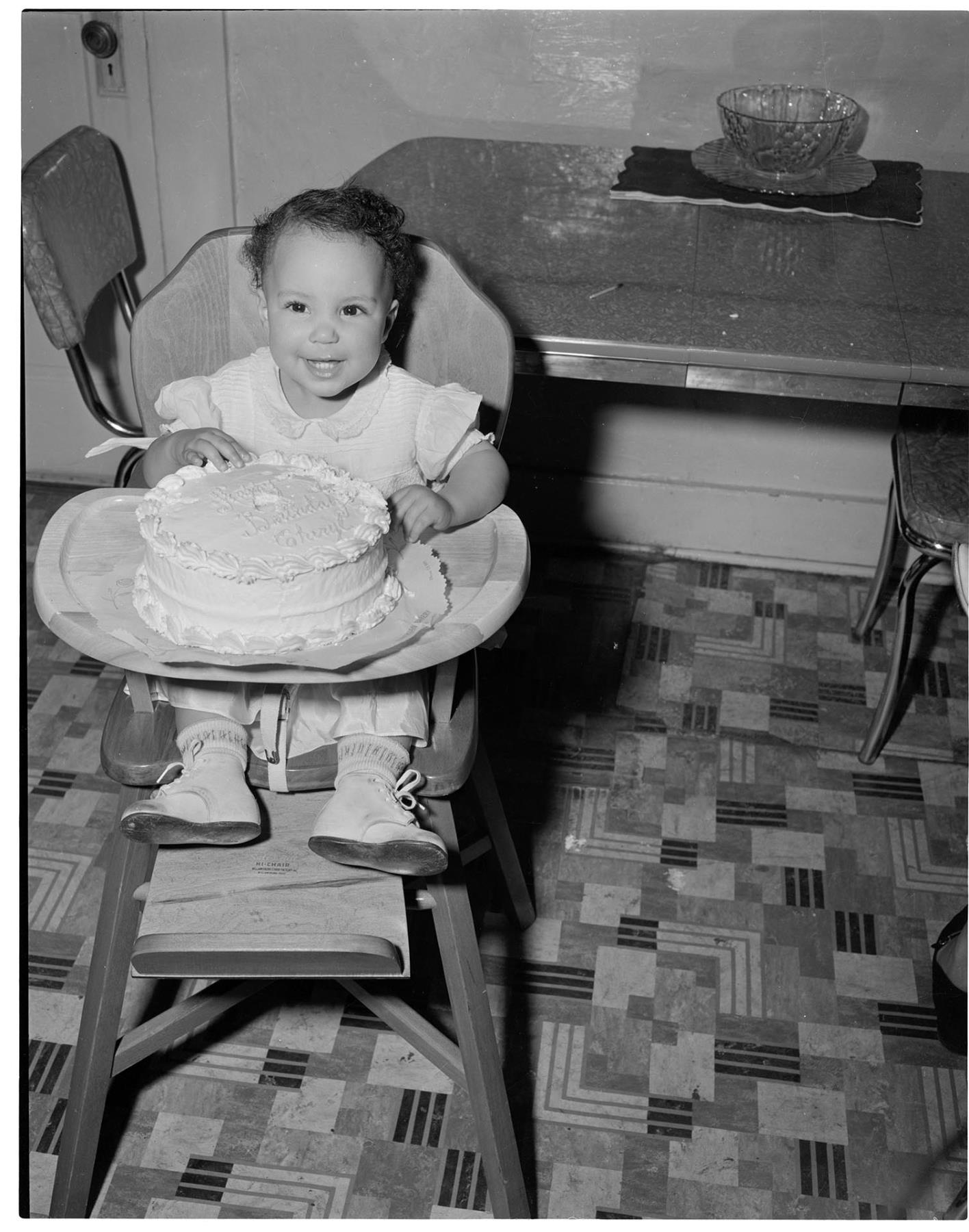 Image of Cheryl Inez Smith sitting in kitchen, Seattle, circa 1955