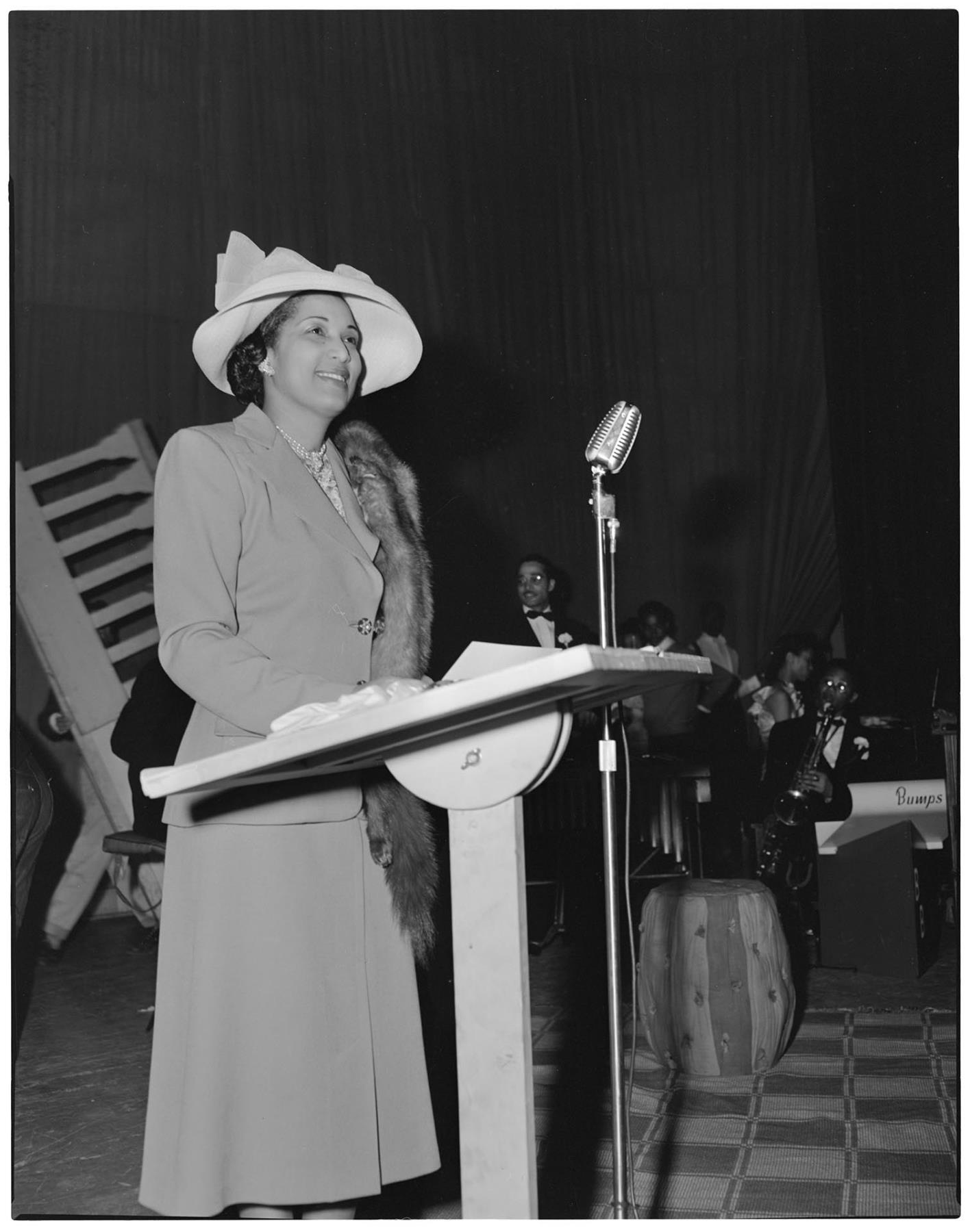 Image of Ola Browning speaking at fashion show, Seattle, circa 1953